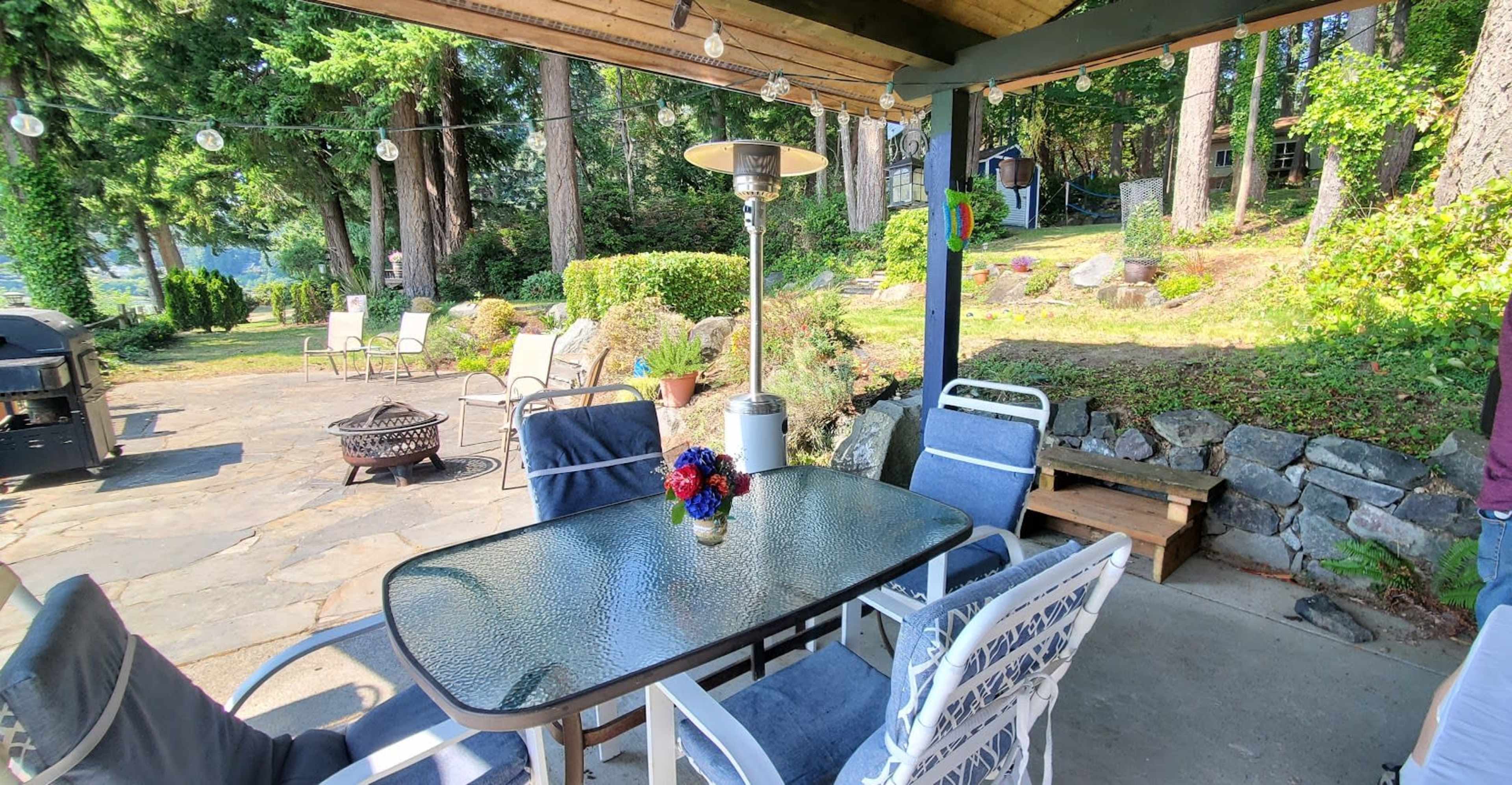 Cute Wide Waterfront Garden Patio Looking Towards Distant Mt. Rainier Image in Wauna, Gig Harbor, WA