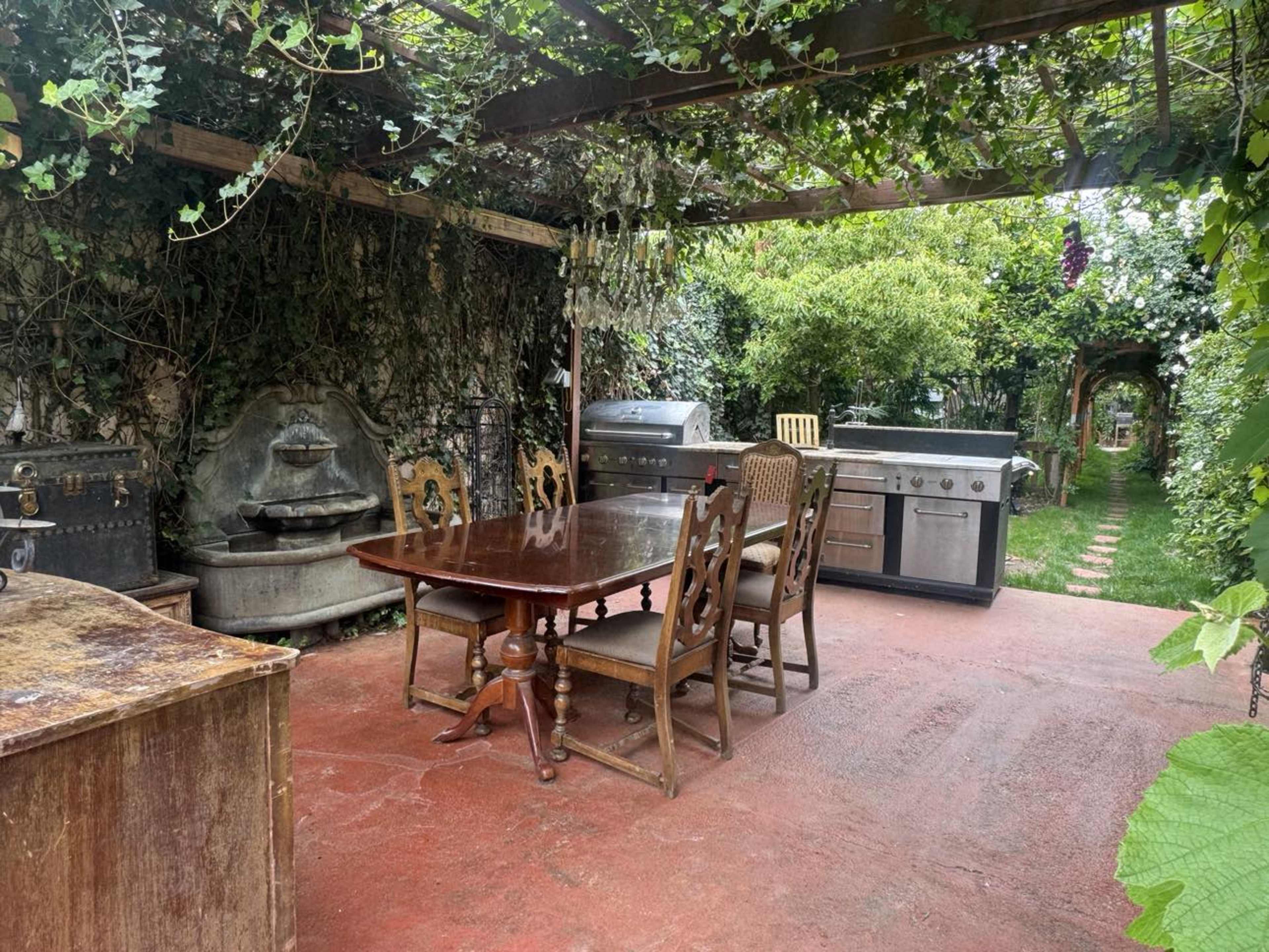 Scenic Spanish-Style Home with Expansive Yards, Sunroom, Citrus Orchard & Storybook Cottage Image in Glenwood, Glendale, CA