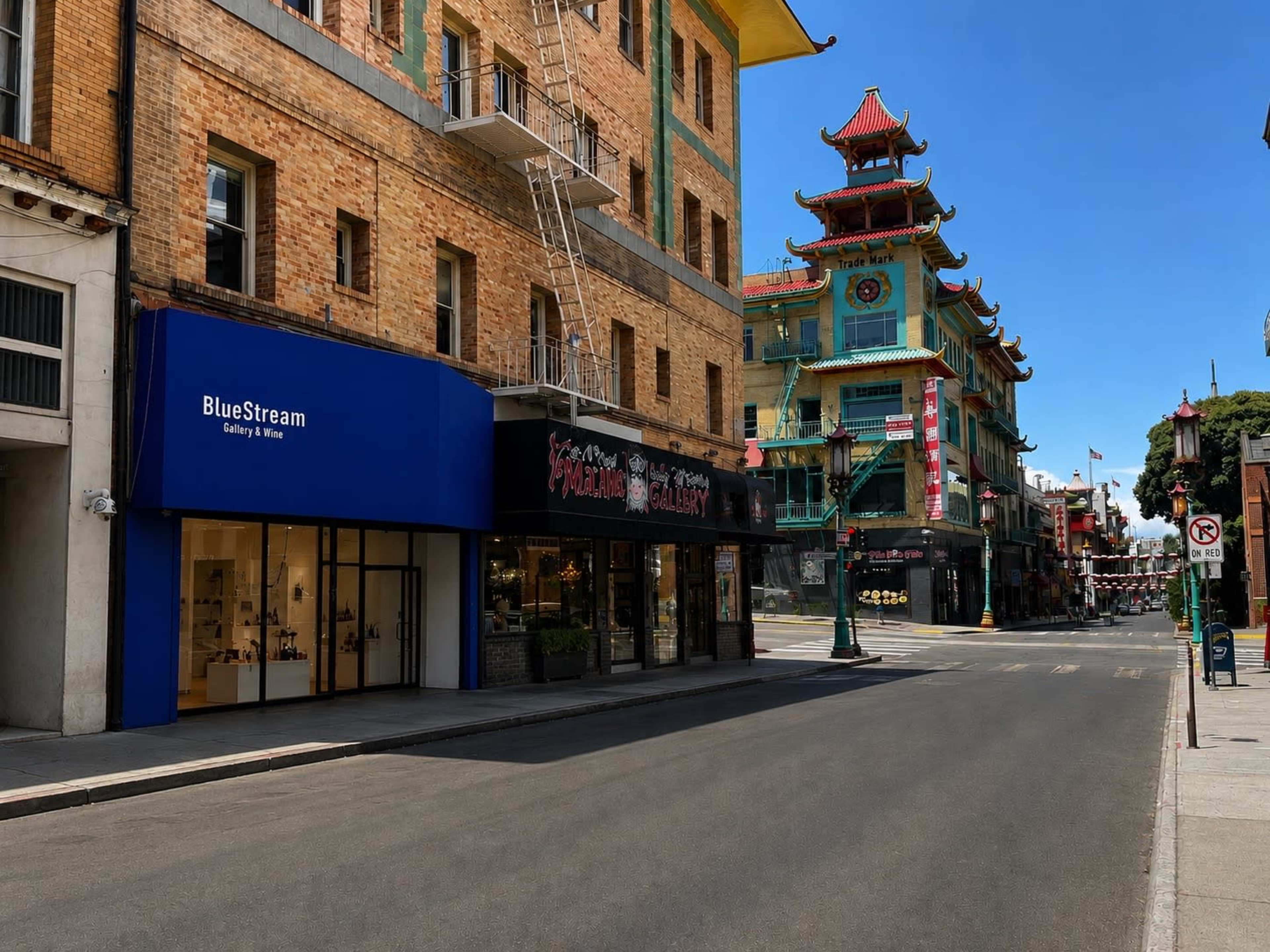 The image shows a quiet street in a Chinatown area with a prominent blue storefront for "BlueStream" and traditional Chinese architecture in the background.