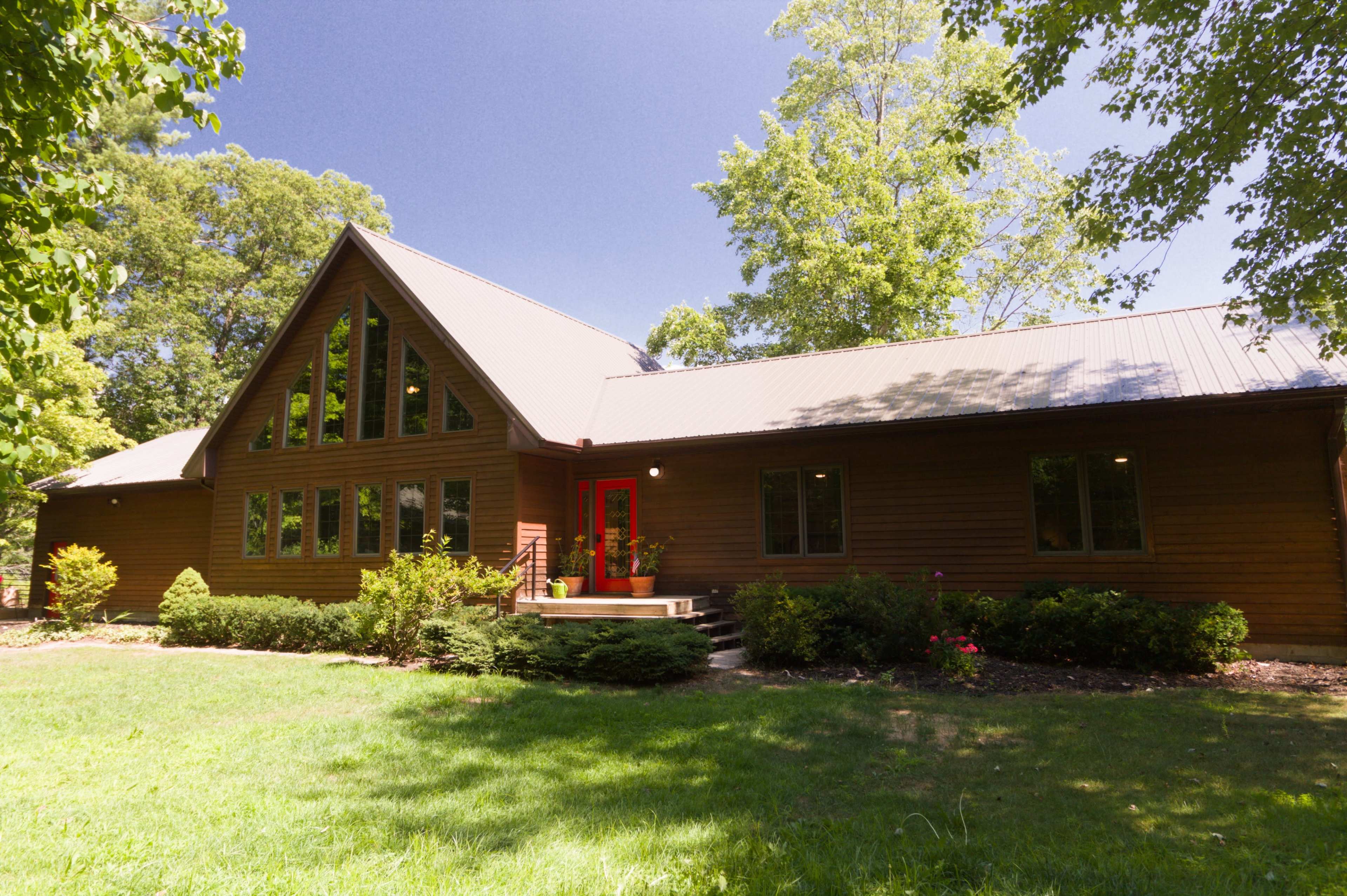 Rustic A-Frame Surrounded by Nature Image in Cedar Creek Township, Twin Lake, MI