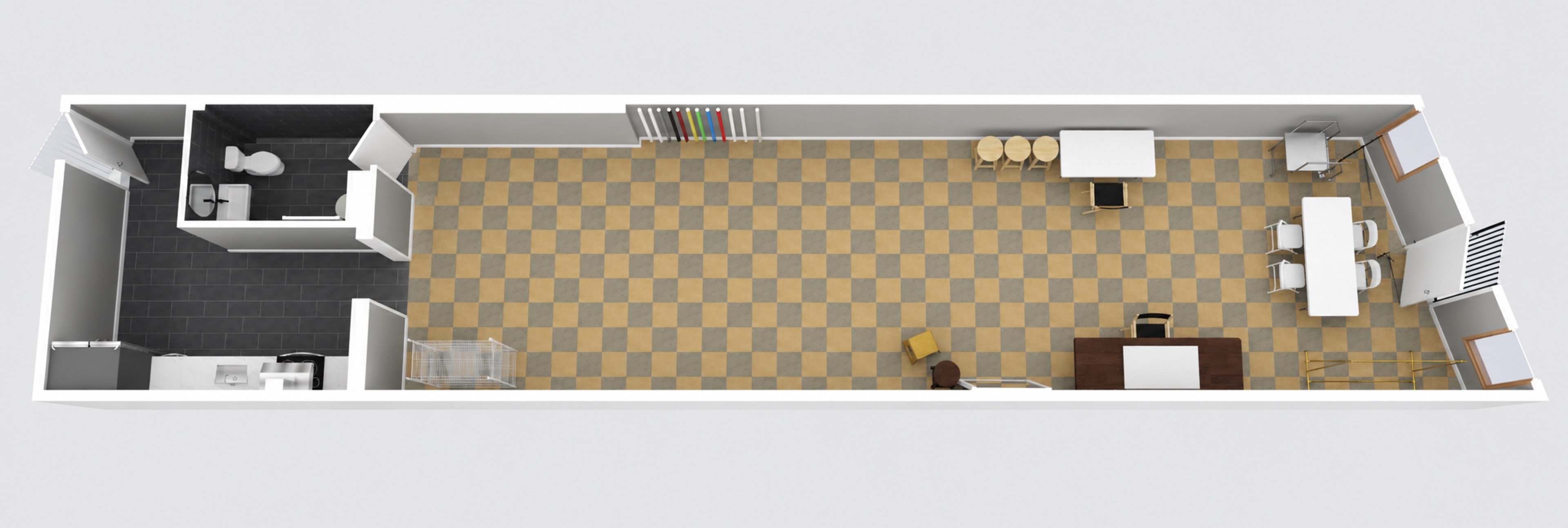 The image depicts an overhead layout of a rectangular room featuring a bathroom, several tables and chairs, and a designated area for storage.