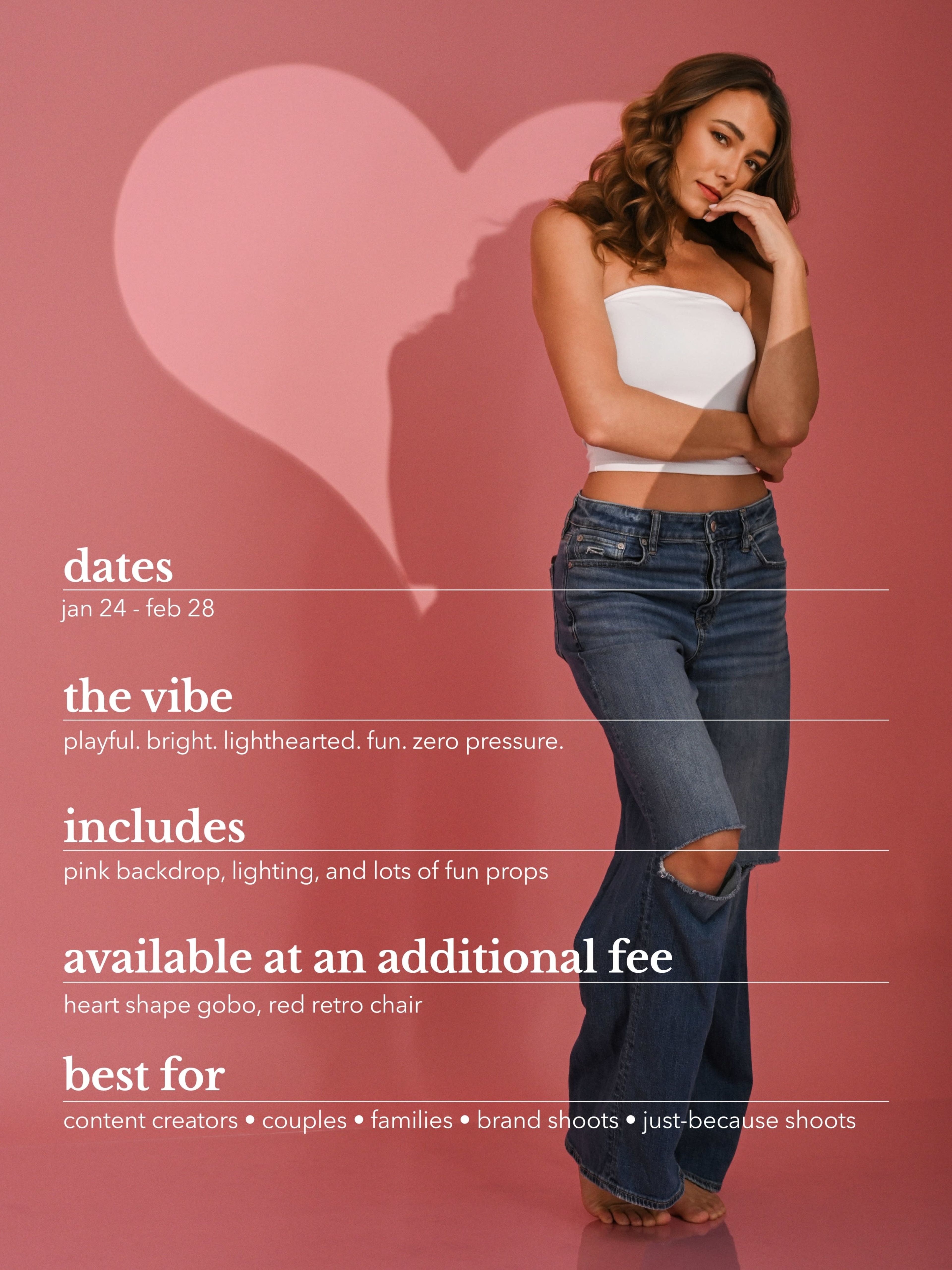 The image features a woman posing in front of a pink backdrop with a heart shape, wearing a white crop top and blue jeans, alongside promotional details for a photo shoot event.