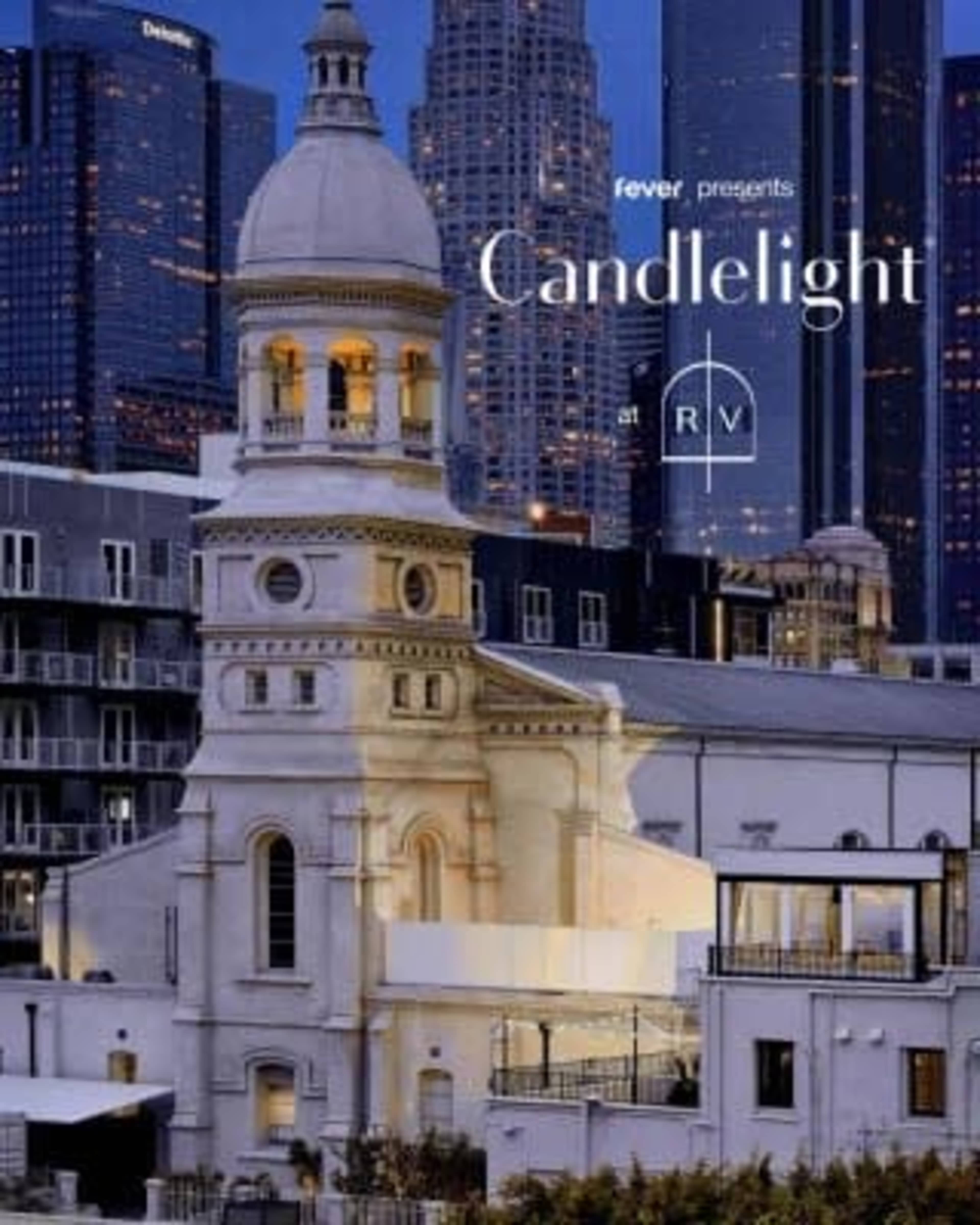 The image features a historic building with a prominent dome and tower, illuminated against a backdrop of modern skyscrapers in a cityscape during twilight.