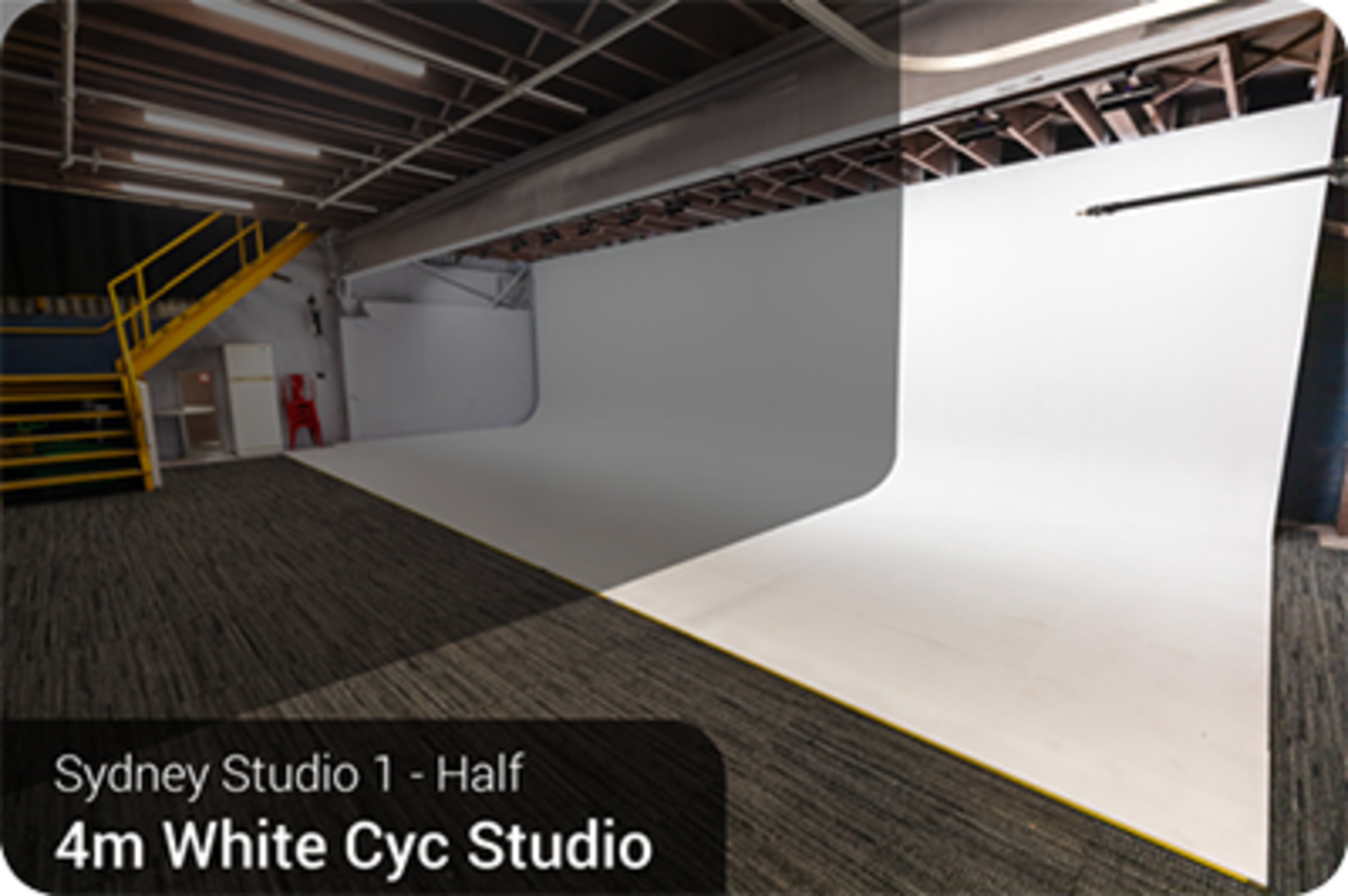 A half section of a 4-meter white cyclorama studio in Sydney, featuring a clean, expansive backdrop and a polished floor.