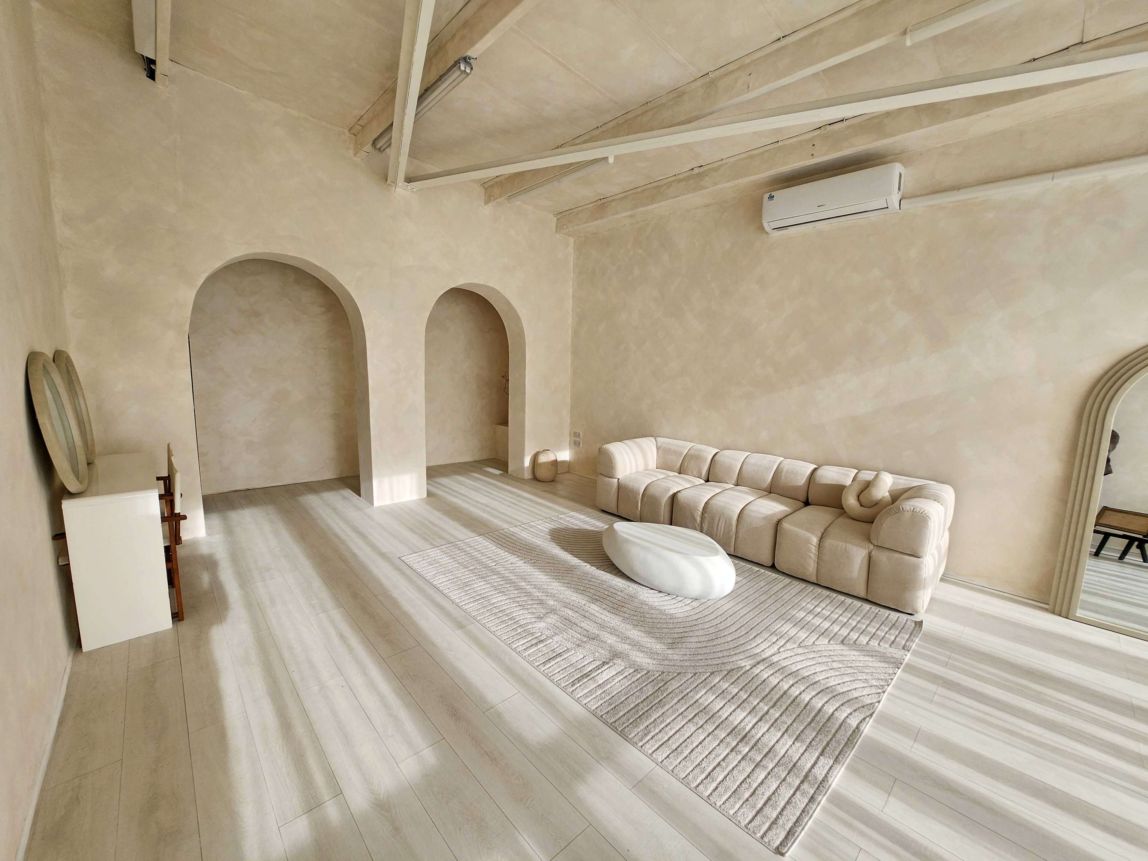 Sun-Kissed Lifestyle Studio with Elegant Arches & Textured Walls Image in London, Canning Town, ENG