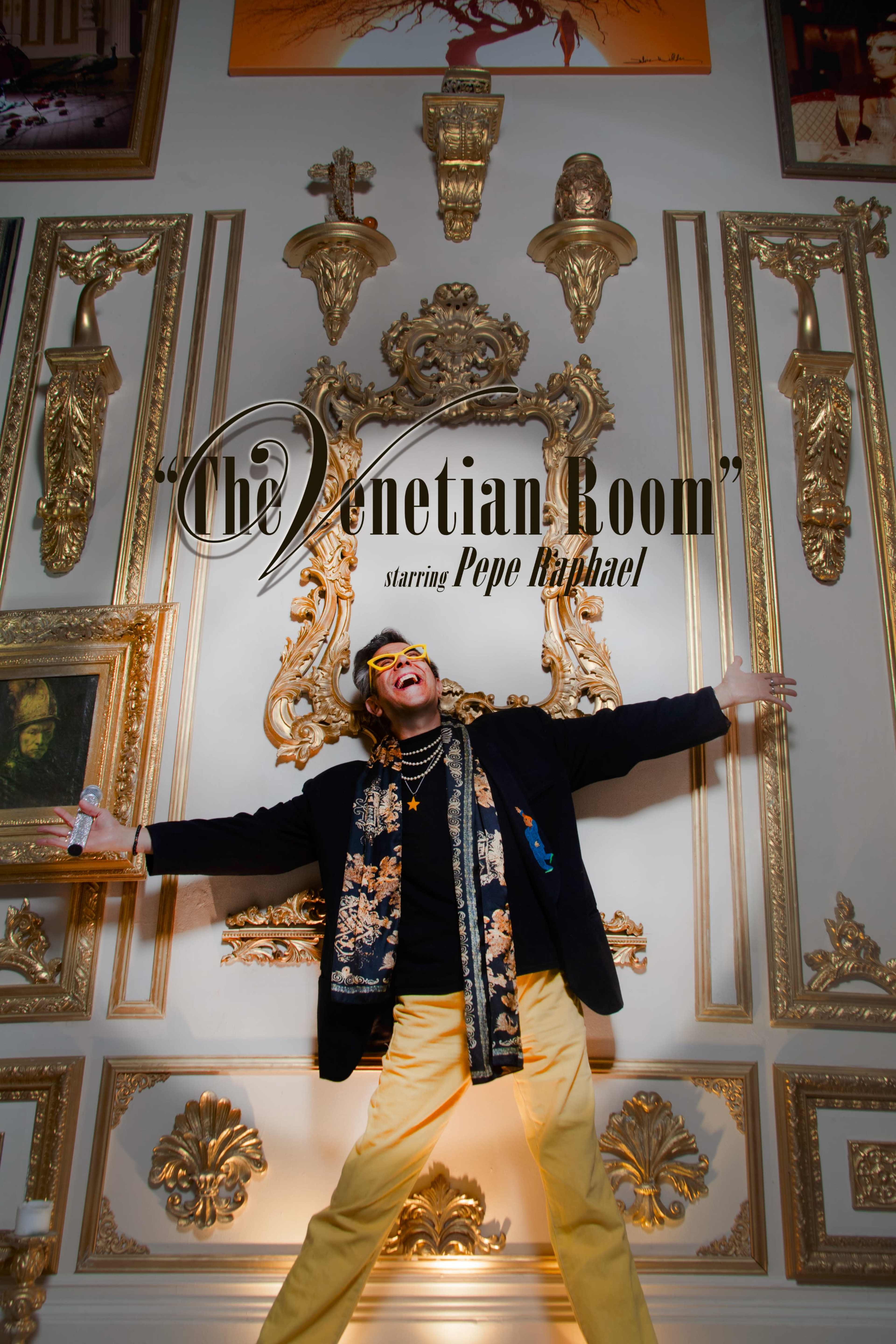 A person poses enthusiastically in a lavishly decorated room featuring ornate gold details and artwork.
