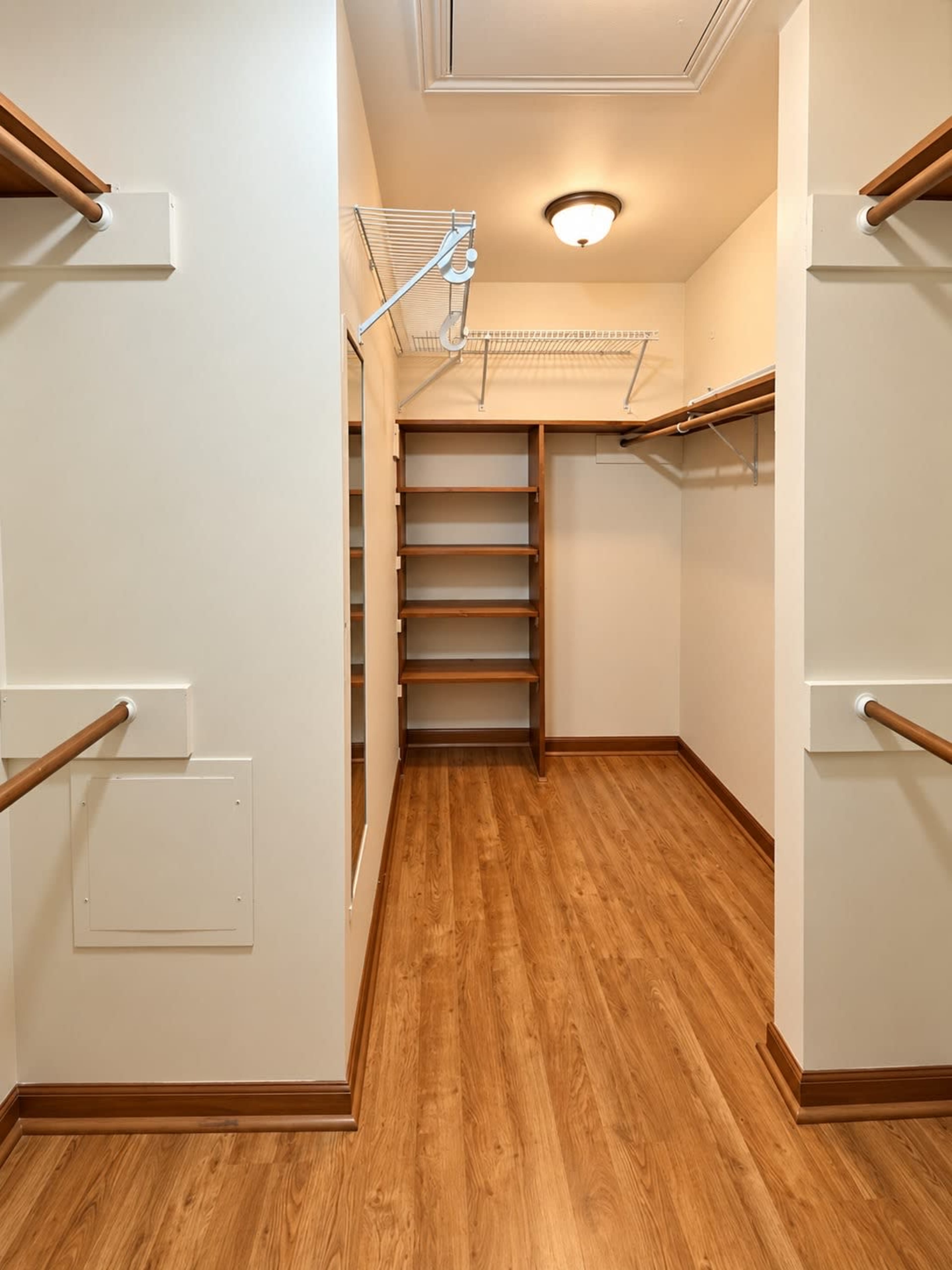 The image shows an empty walk-in closet with wooden shelves and hanging rods on two walls.