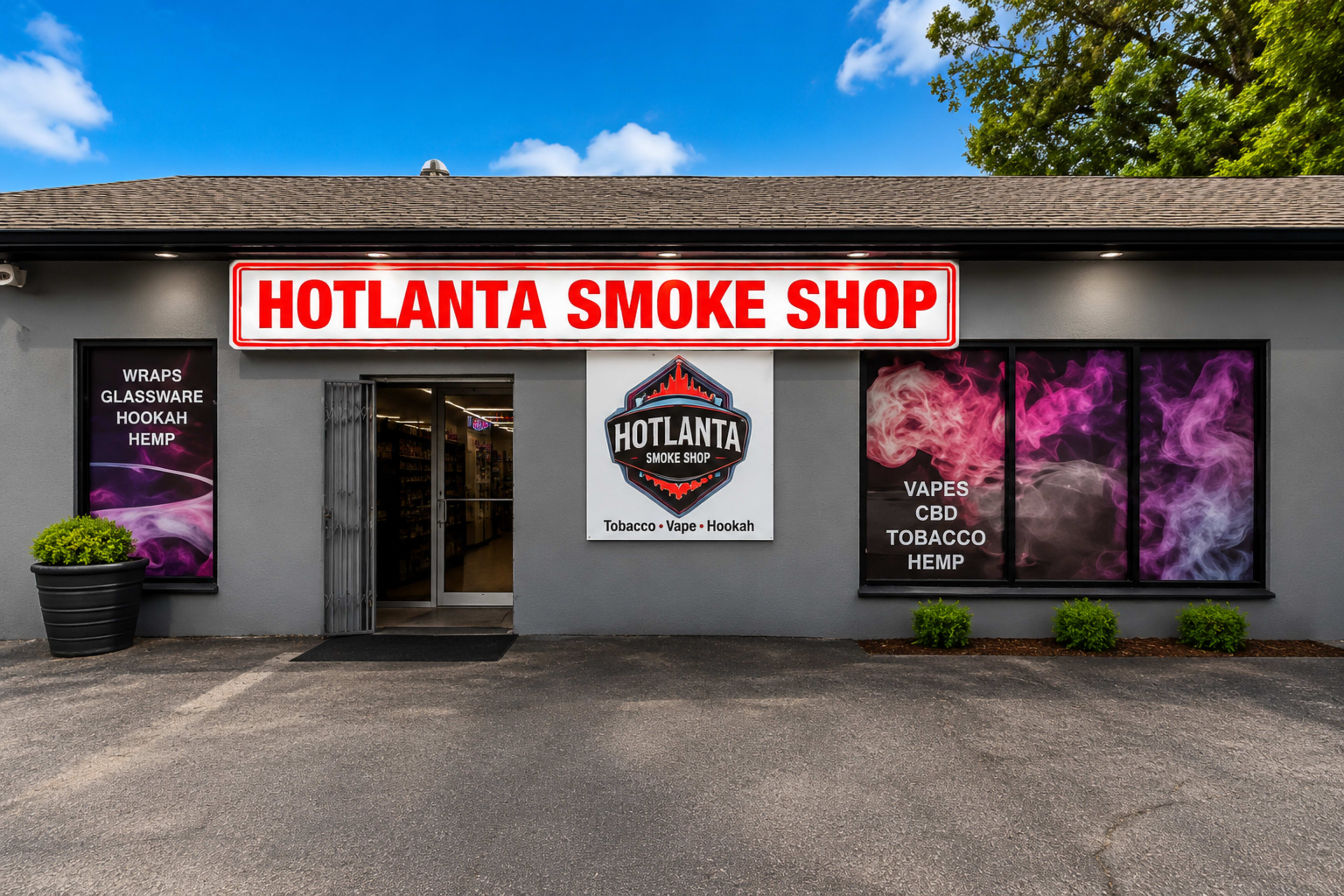 The image features the storefront of Hotlanta Smoke Shop, displaying colorful signage and promotional graphics related to tobacco, vape, hookah, and hemp products.