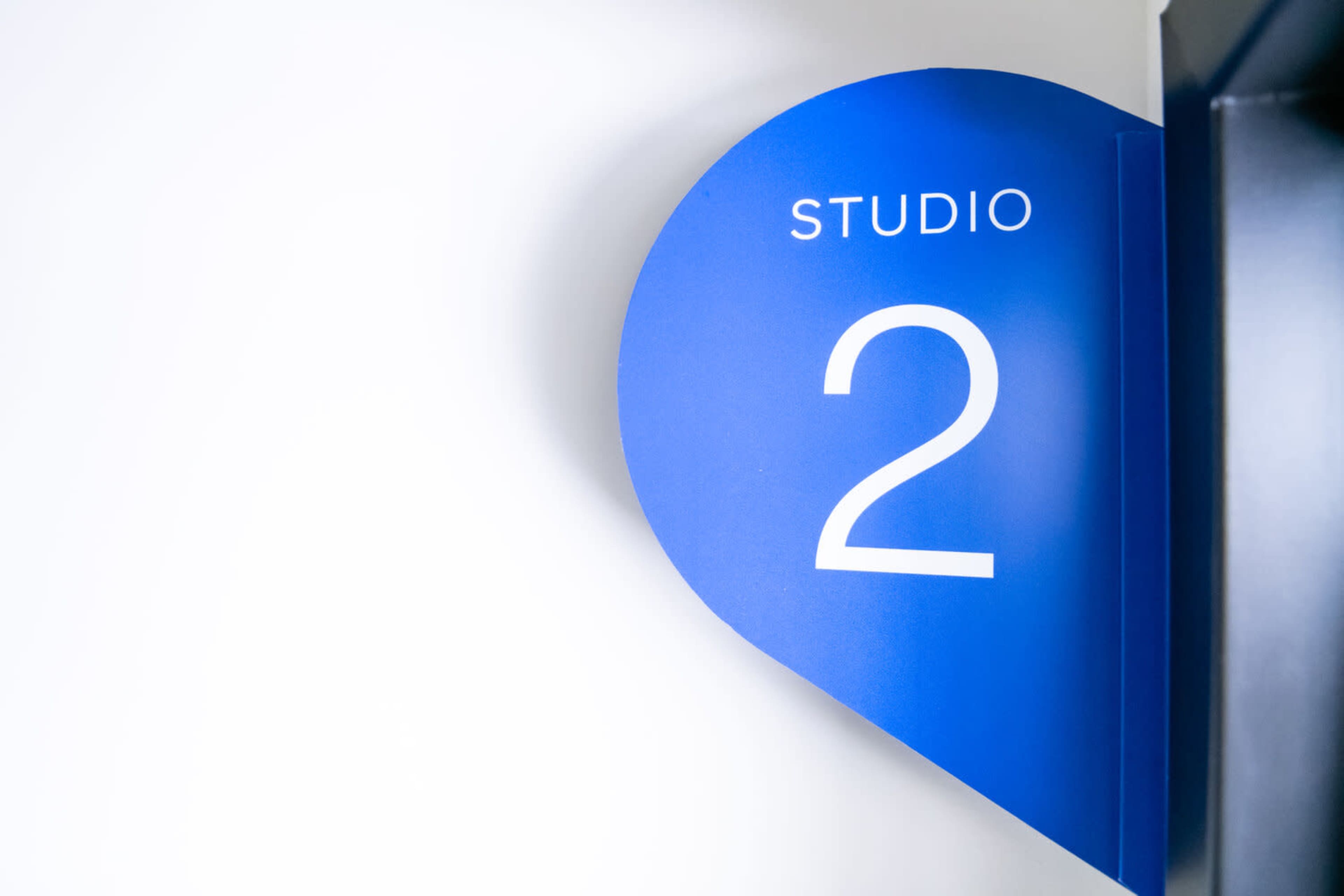 A blue wall sign displays the text "STUDIO 2."