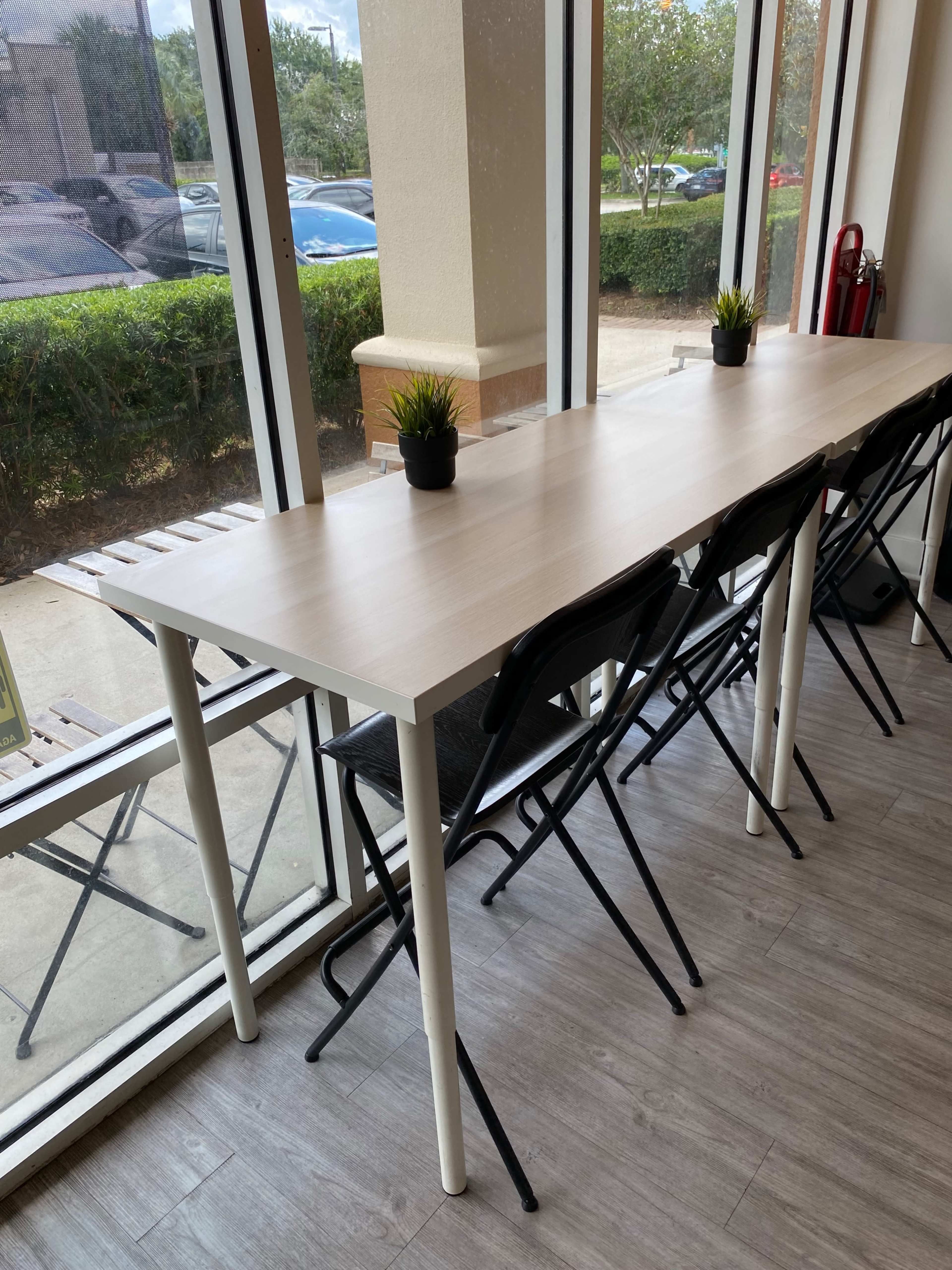 An Ice Cream space with tables, chairs, super Clean restrooms and free wifi. Image in Deerfield Village, Orlando, FL