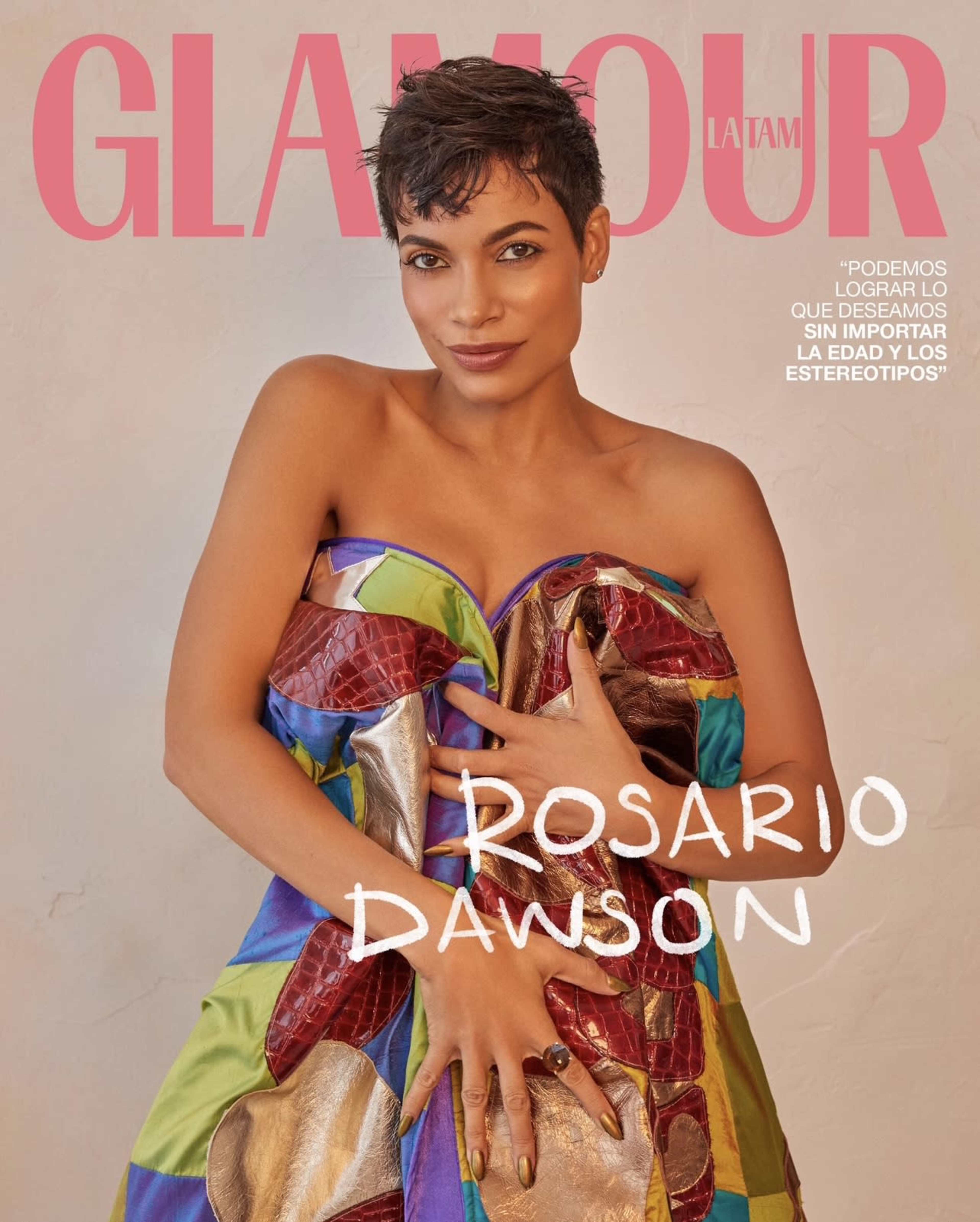 A woman in a colorful, strapless dress posing confidently for the cover of Glamour magazine.