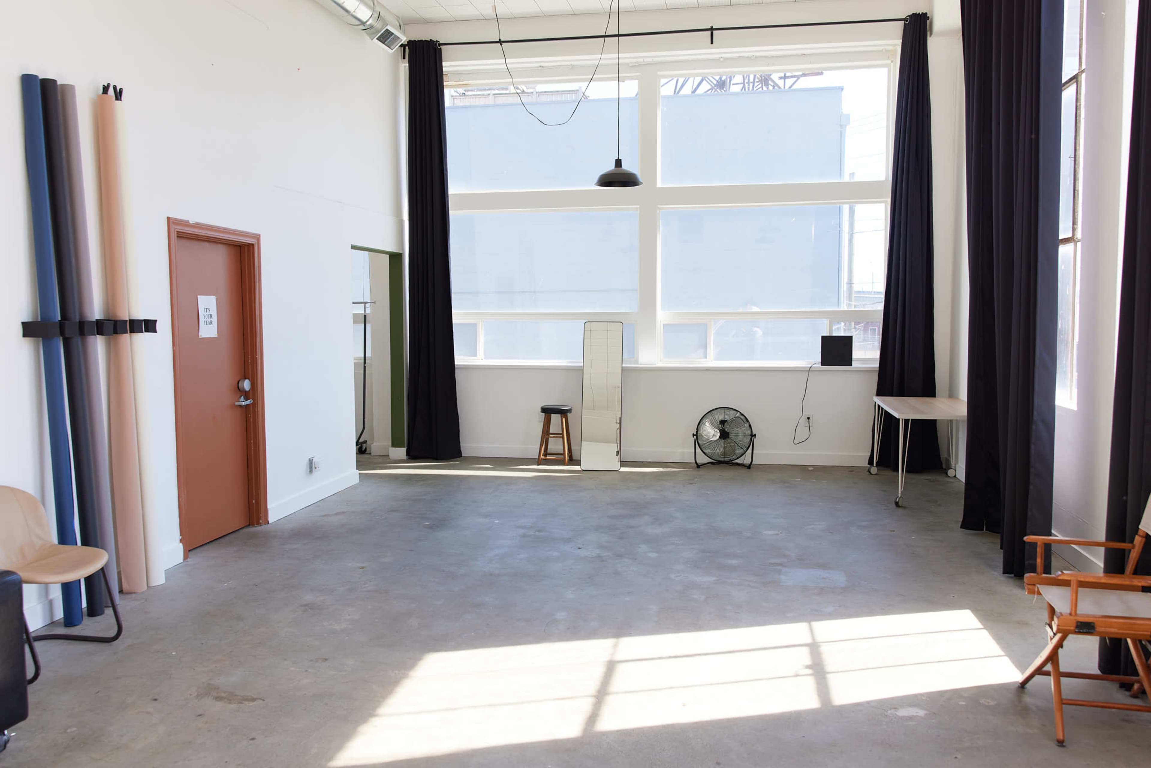 Clean White Studio with Concrete Floors & Natural Light Image in SODO, Seattle, WA