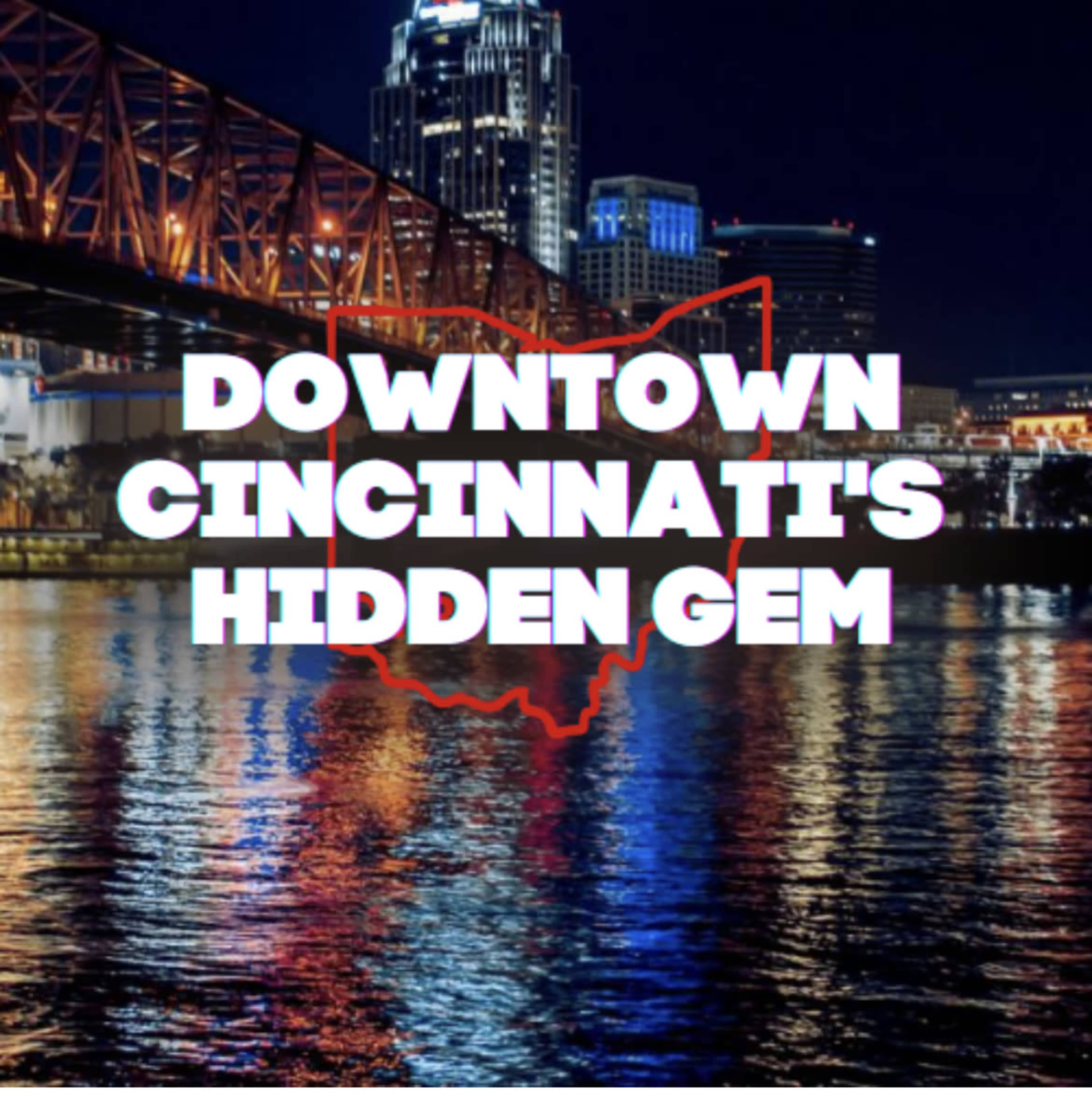 A nighttime view of downtown Cincinnati with illuminated buildings reflected in the water and a graphic outline of Ohio.