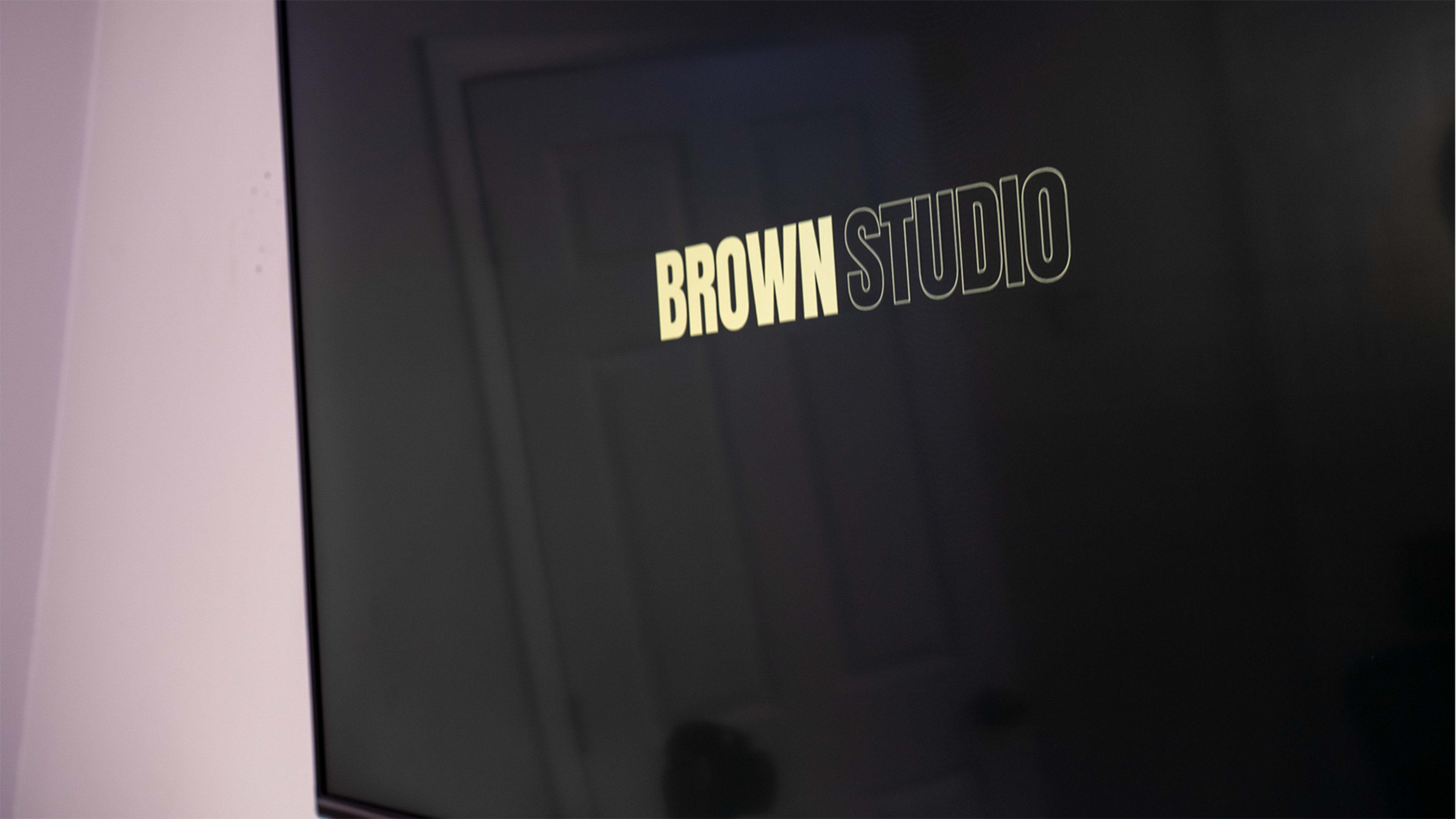 A close-up of a screen displaying the text "BROWN STUDIO" in a bold font.