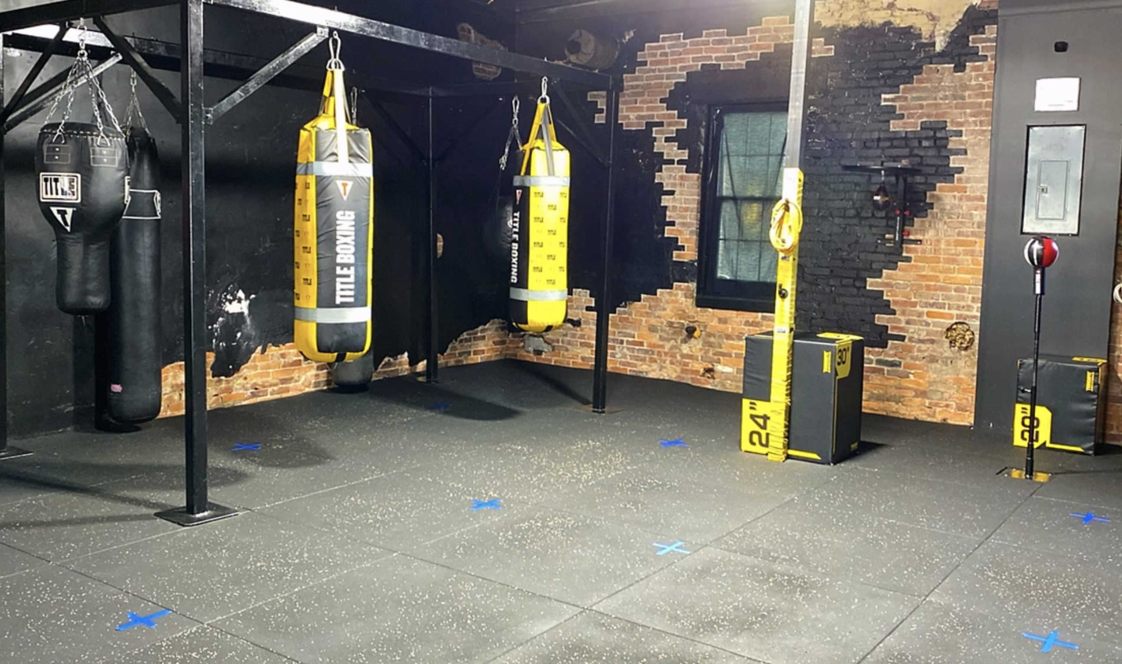 Full Boxin Gym / Boxing Ring / Punching Bags / Weights Area (Old Bricks Walls) (Black Walls) Downtown Saint Cloud Fl Image in St. Cloud, Saint Cloud, FL