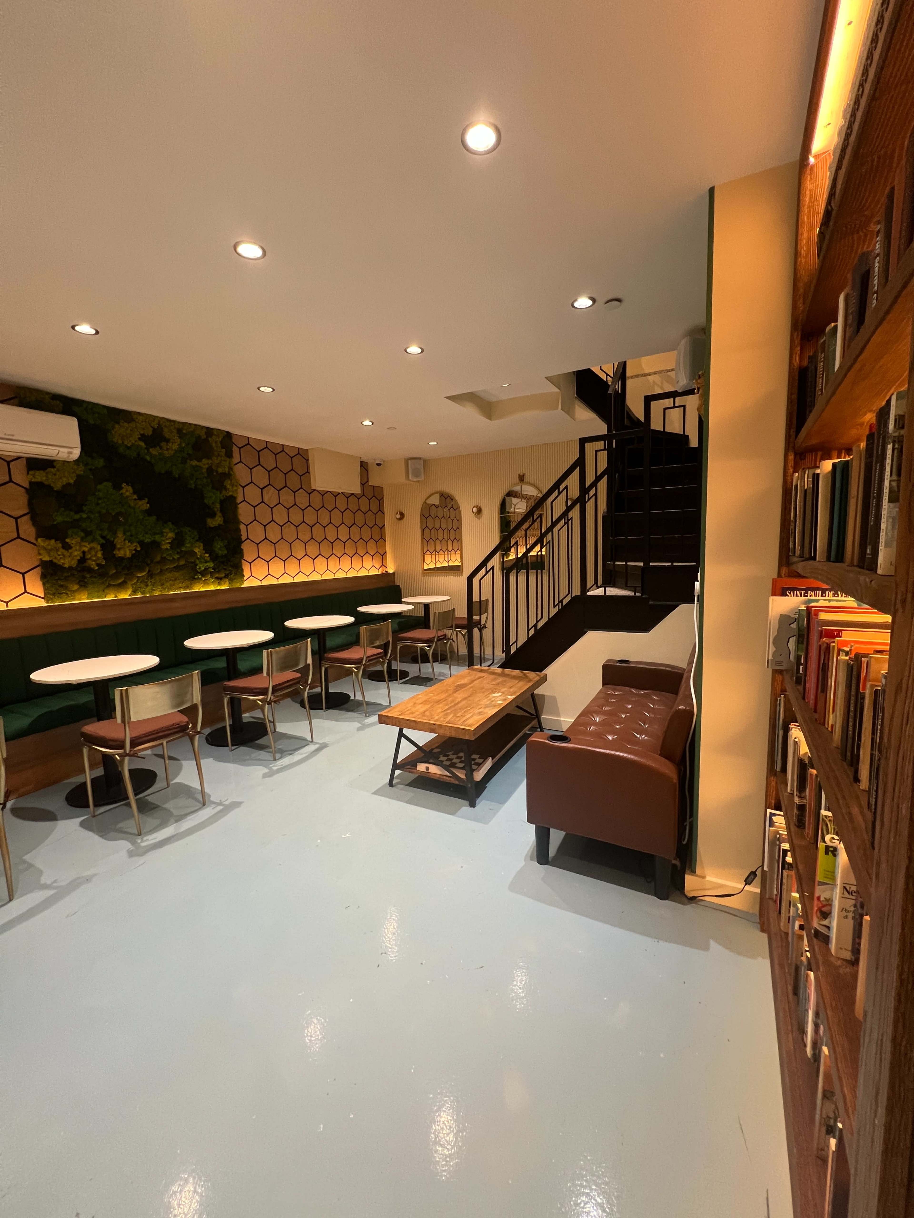 Cozy Brooklyn Lounge with Green Wall & Library Image in Sunset Park, Brooklyn, NY