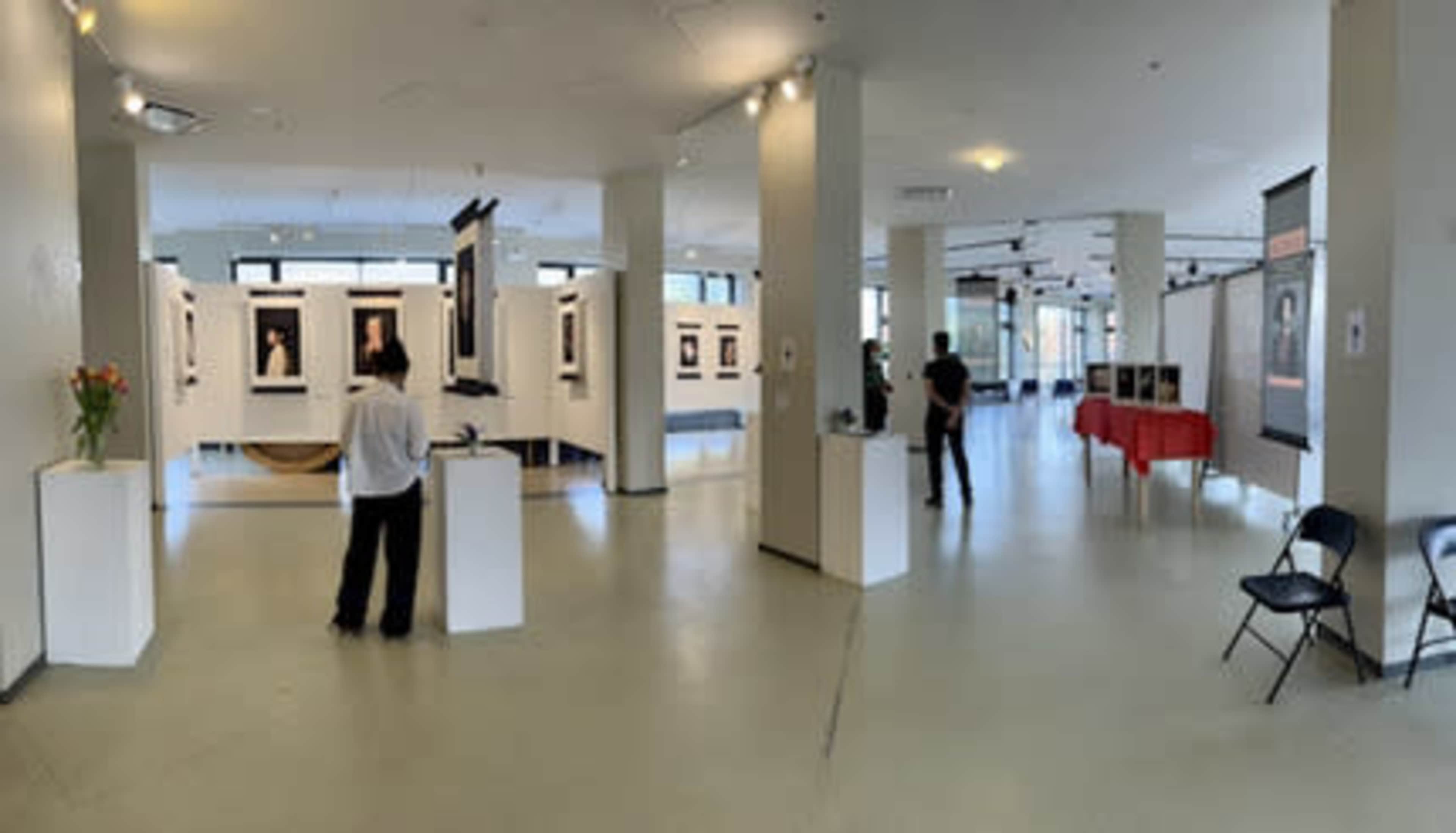 Large open floor plan with floor to ceiling windows over looking urban street scape. Image in Avondale, Chicago, IL