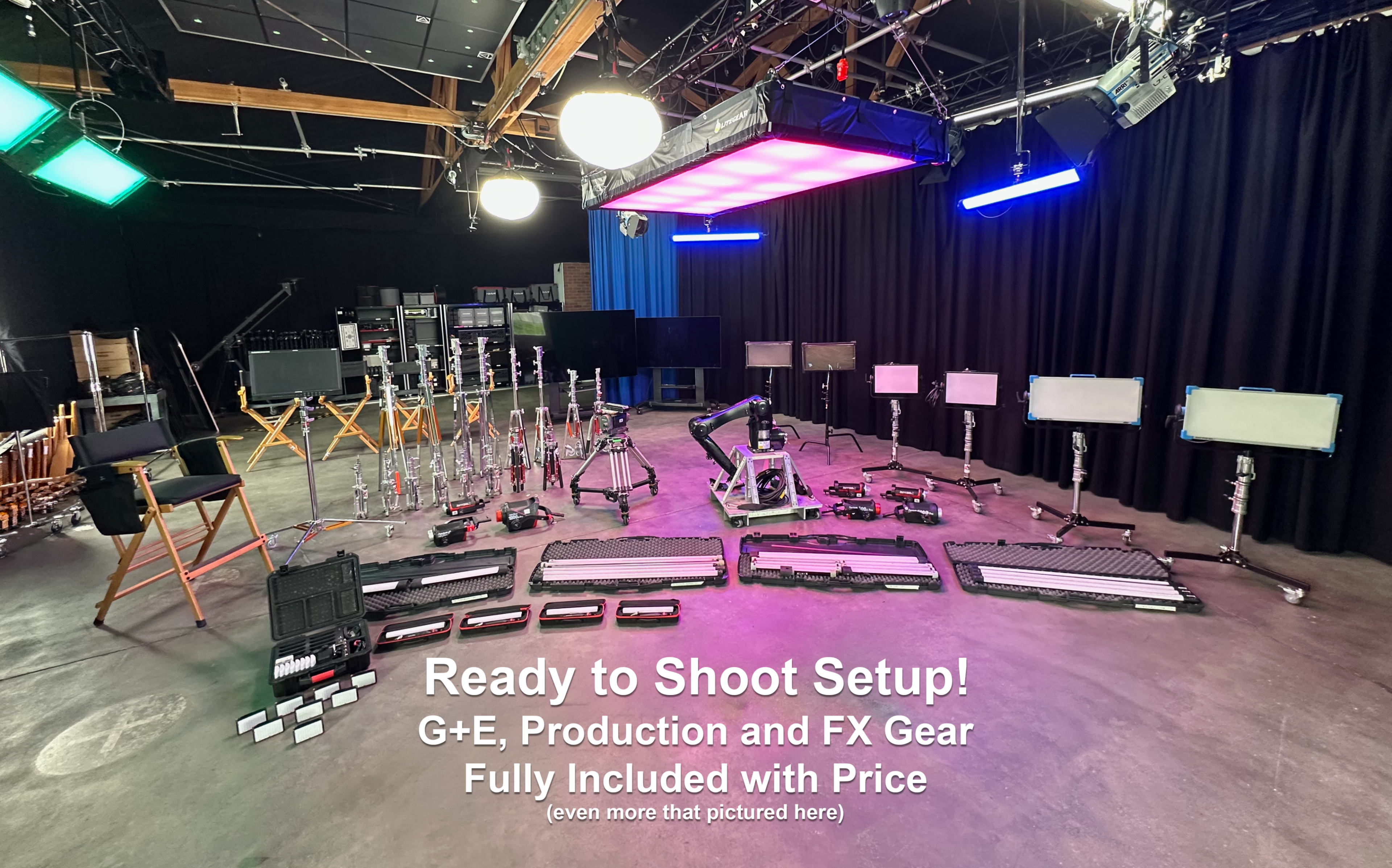 The image shows a film or photography studio set up with various lighting equipment, production gear, and cameras arranged for a shoot.