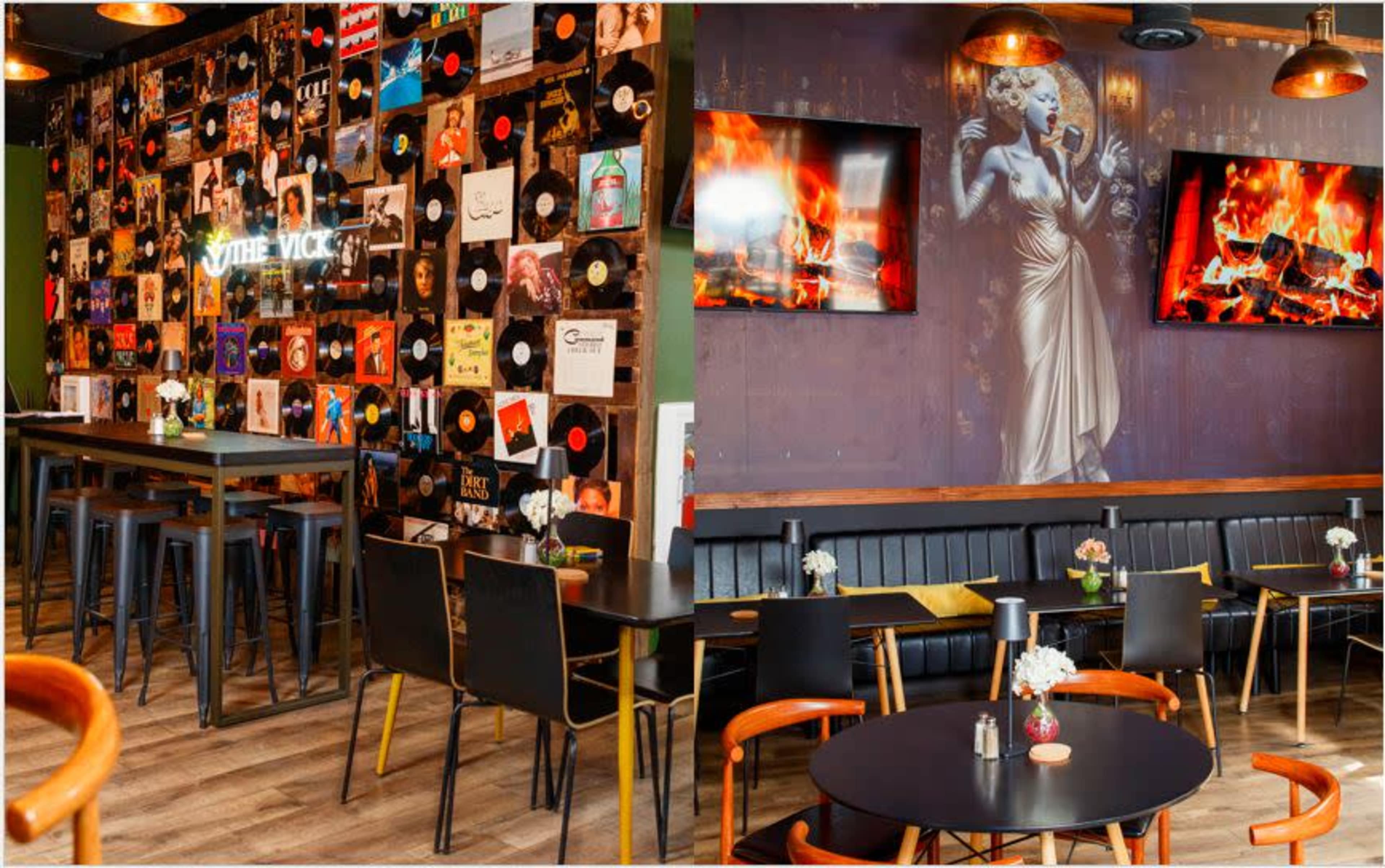 The image shows a modern restaurant interior featuring a wall decorated with vinyl records, tables with black chairs, and wall-mounted TVs displaying a fire scene.
