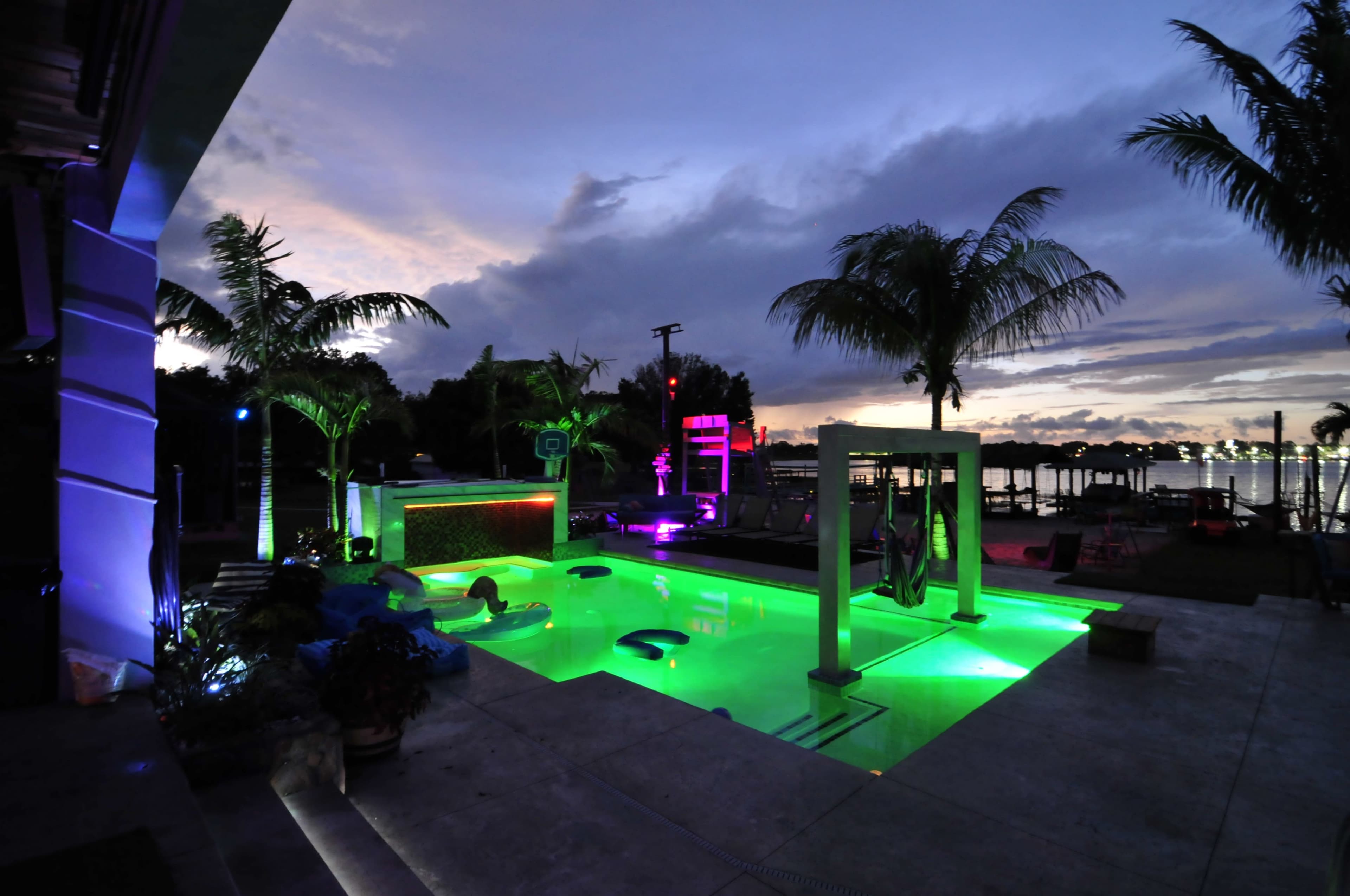 Lakefront grotto Palm Oasis, Sand Volleyball, and Custom Pool Features Image in , Orlando, FL