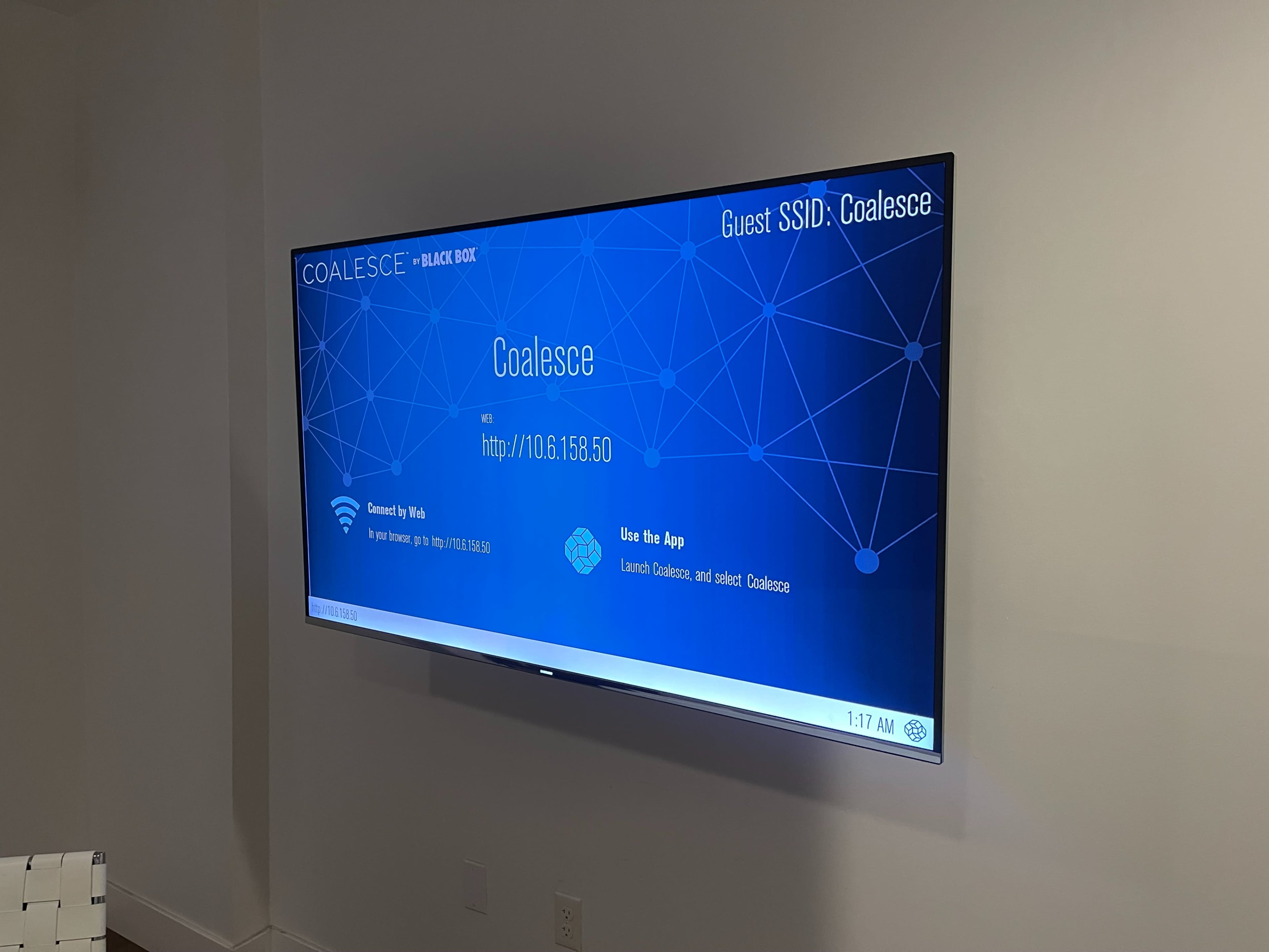 A large television screen displays a network connection screen for "Coalesce" with an IP address and instructions for using the app.