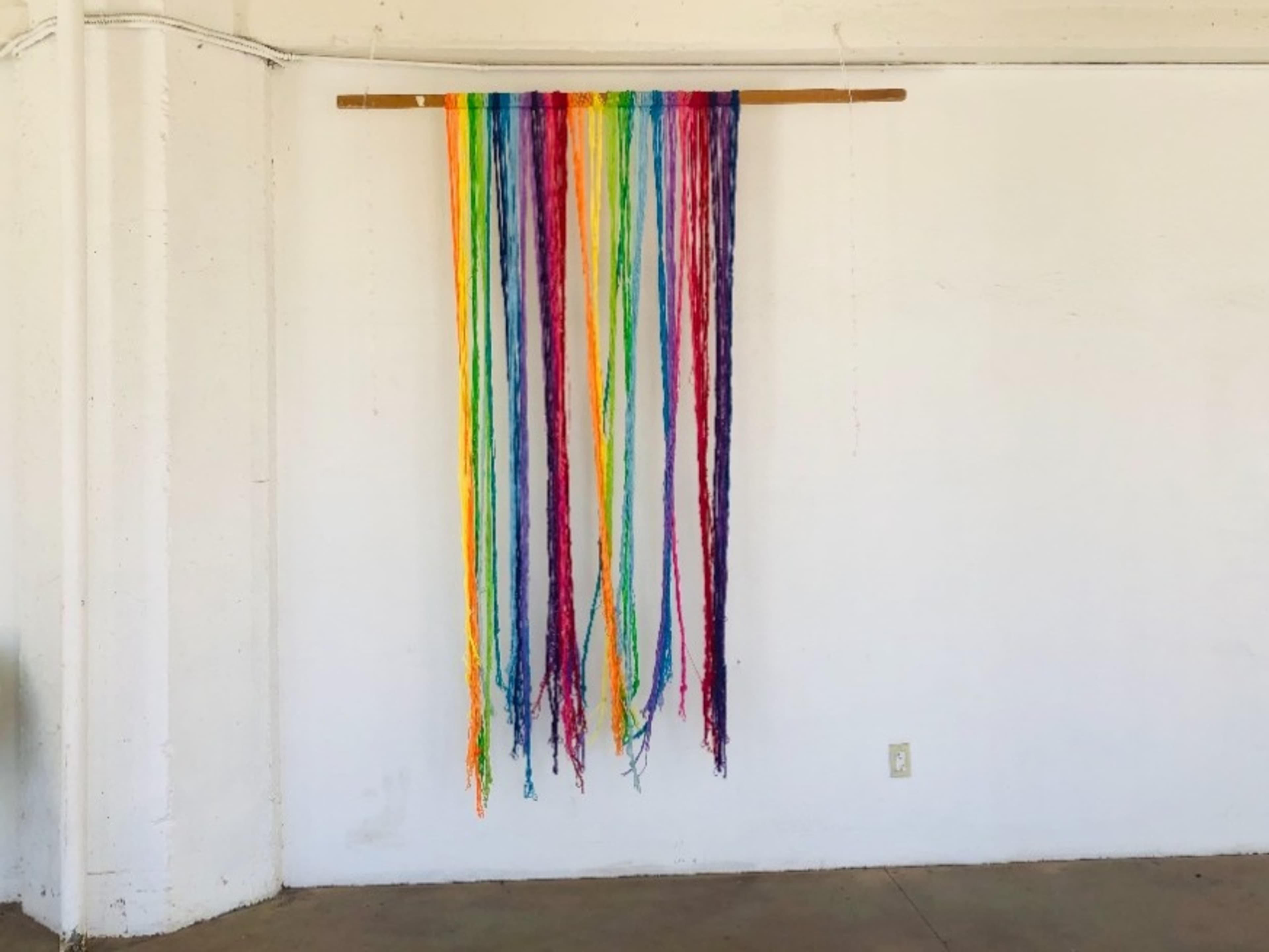 Rainbow yarn curtain