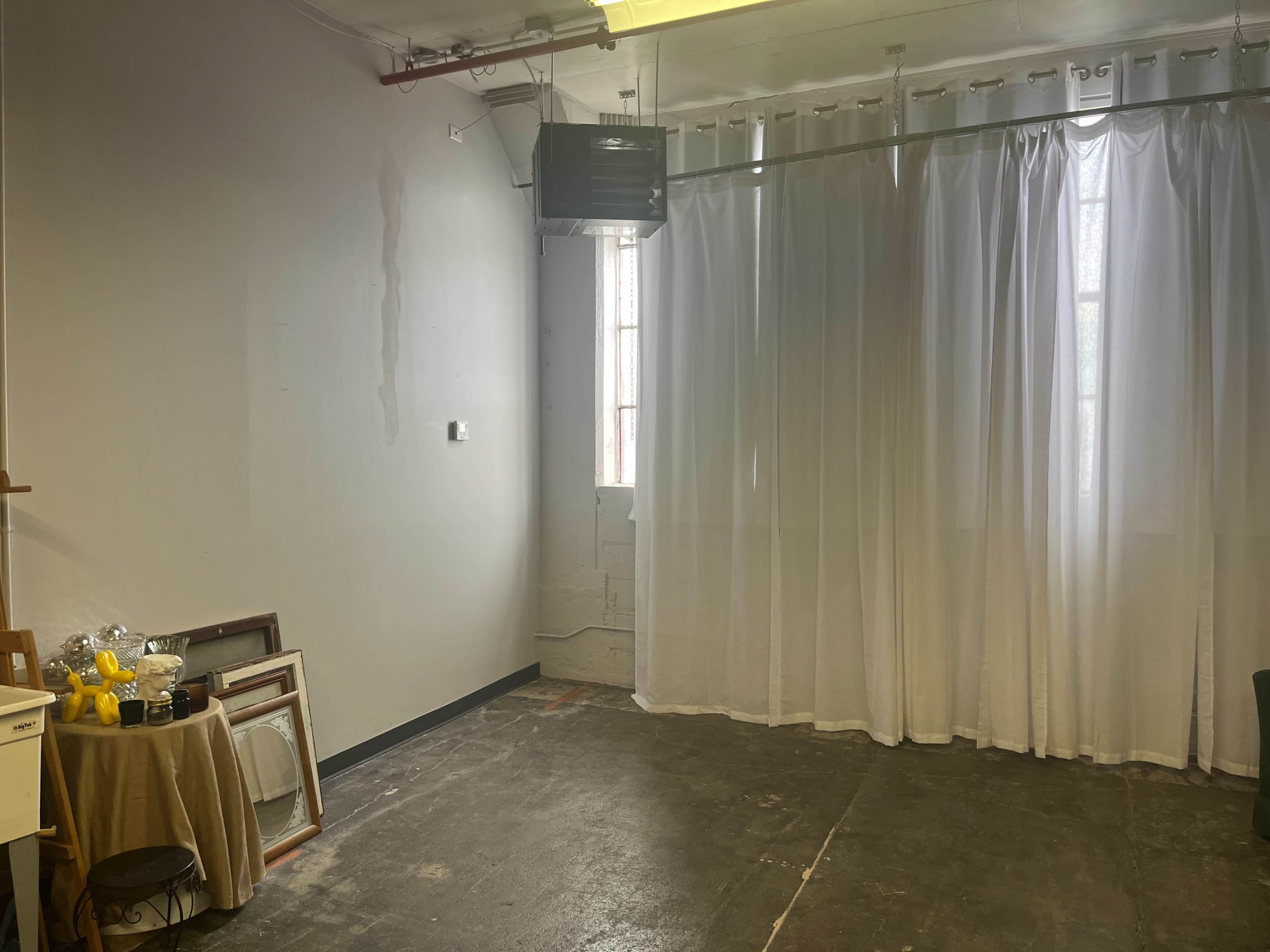 Natural Light-Filled Warehouse Studio with Harbor Skyline View Image in Bay View, Milwaukee, WI