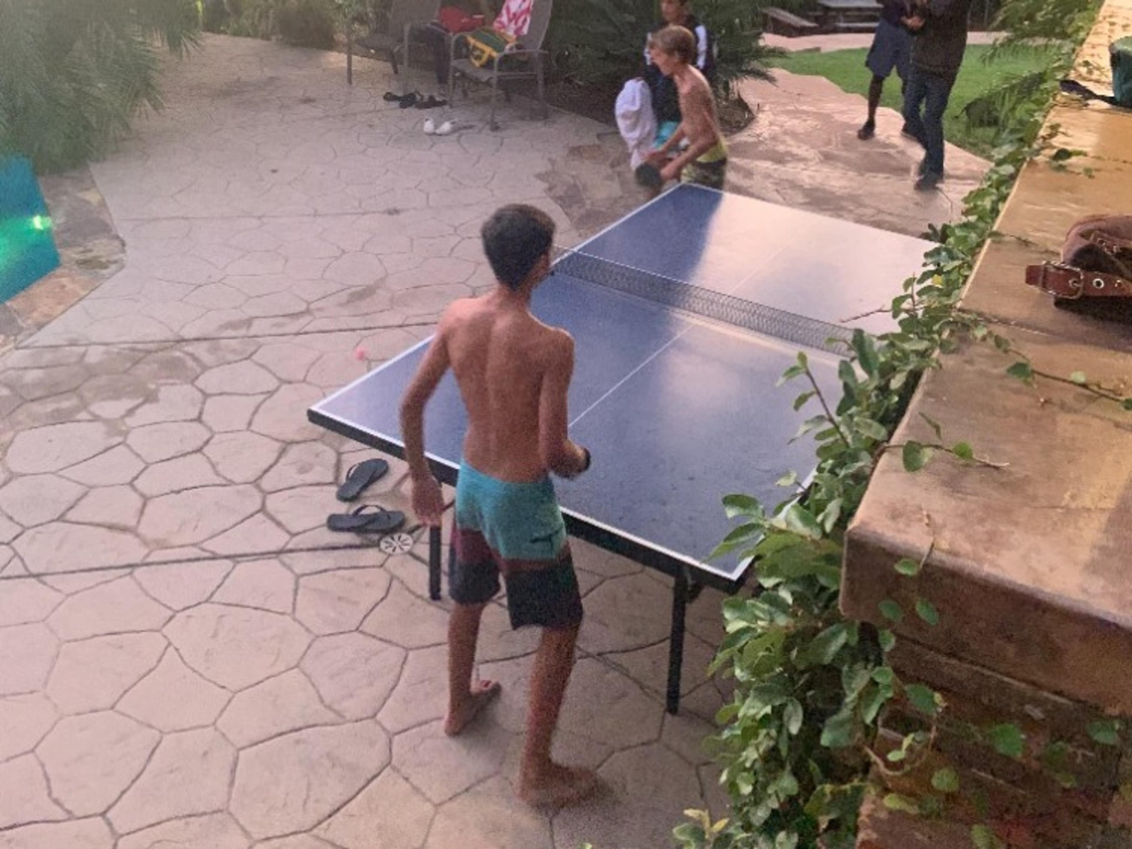 Ping-pong table by the pool