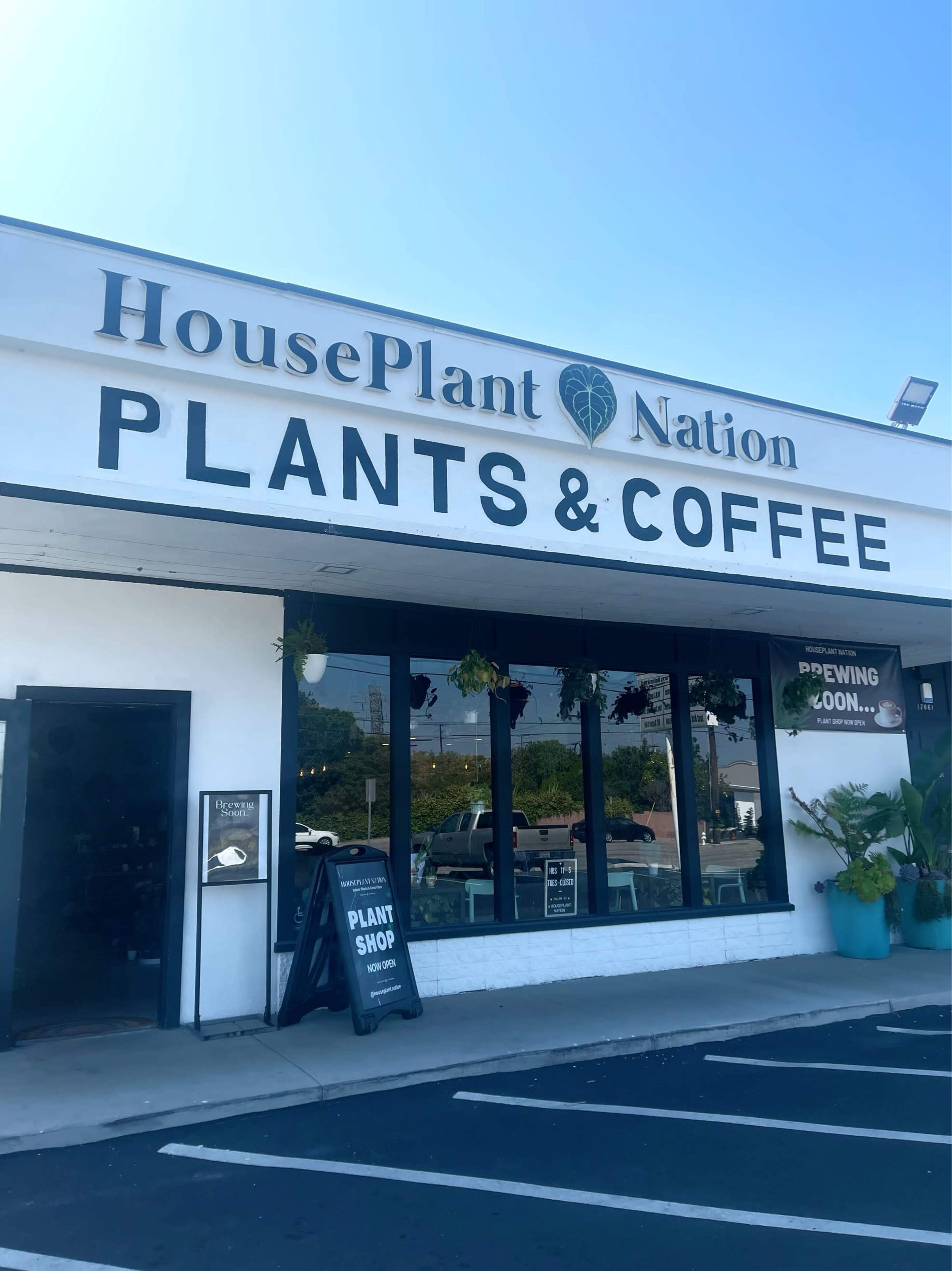 The exterior of HousePlant Nation features a sign that reads "PLANTS & COFFEE" with a "Coming Soon" notice visible in the window.