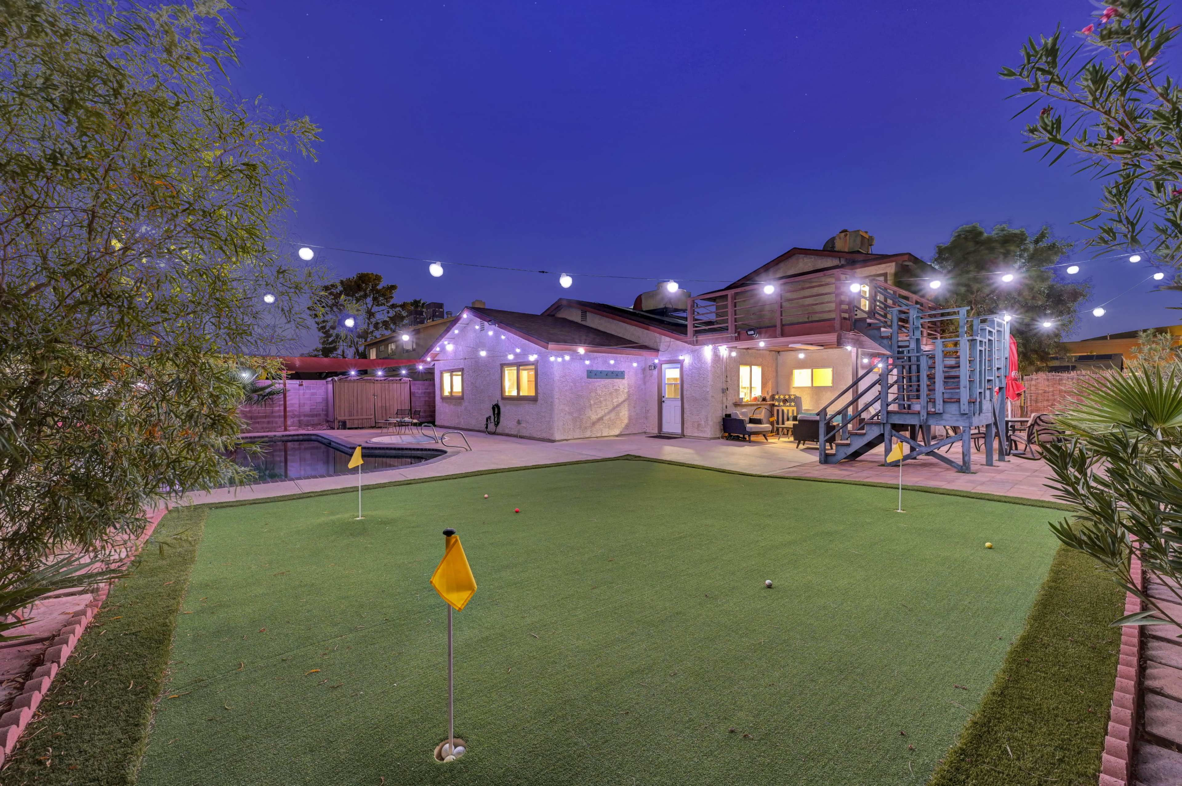 Oasis backyard with putting green, pool/spa/patio area/color string lights etc. Image in Spring Valley, las vegas, NV