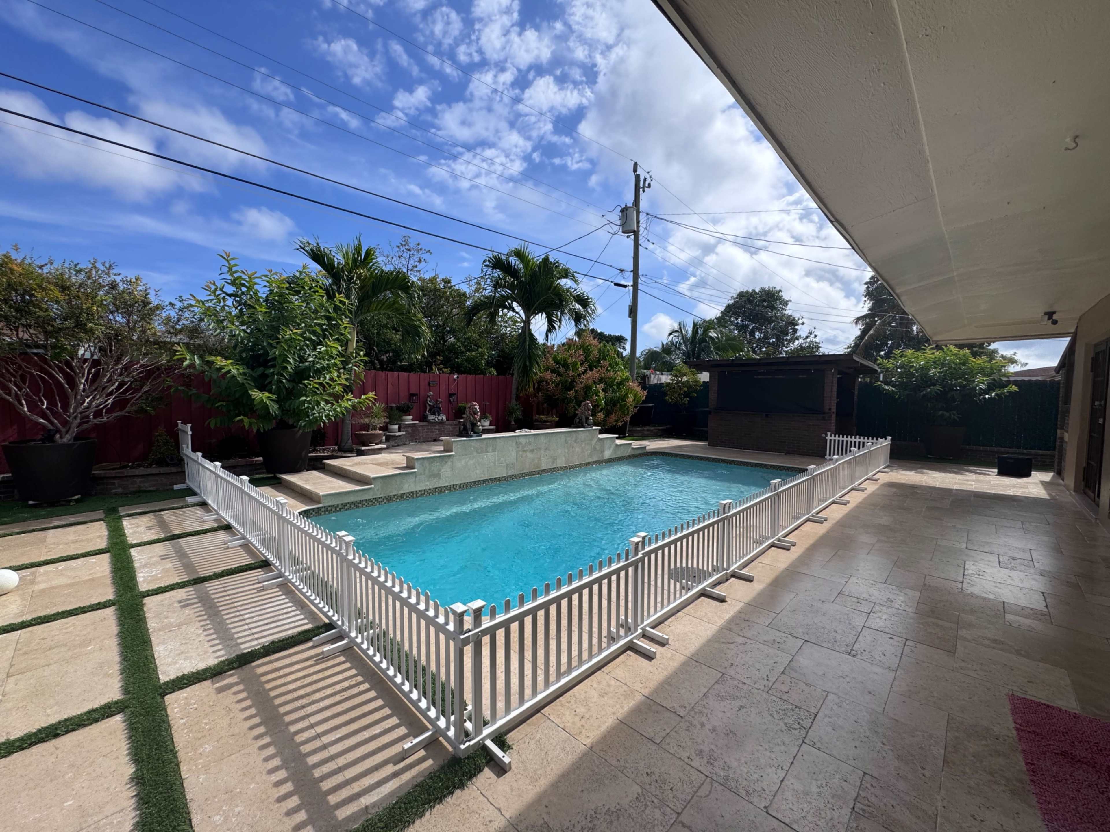Spacious Backyard with Pool and Outdoor Kitchen Image in Pompano Beach, Pompano Beach, FL