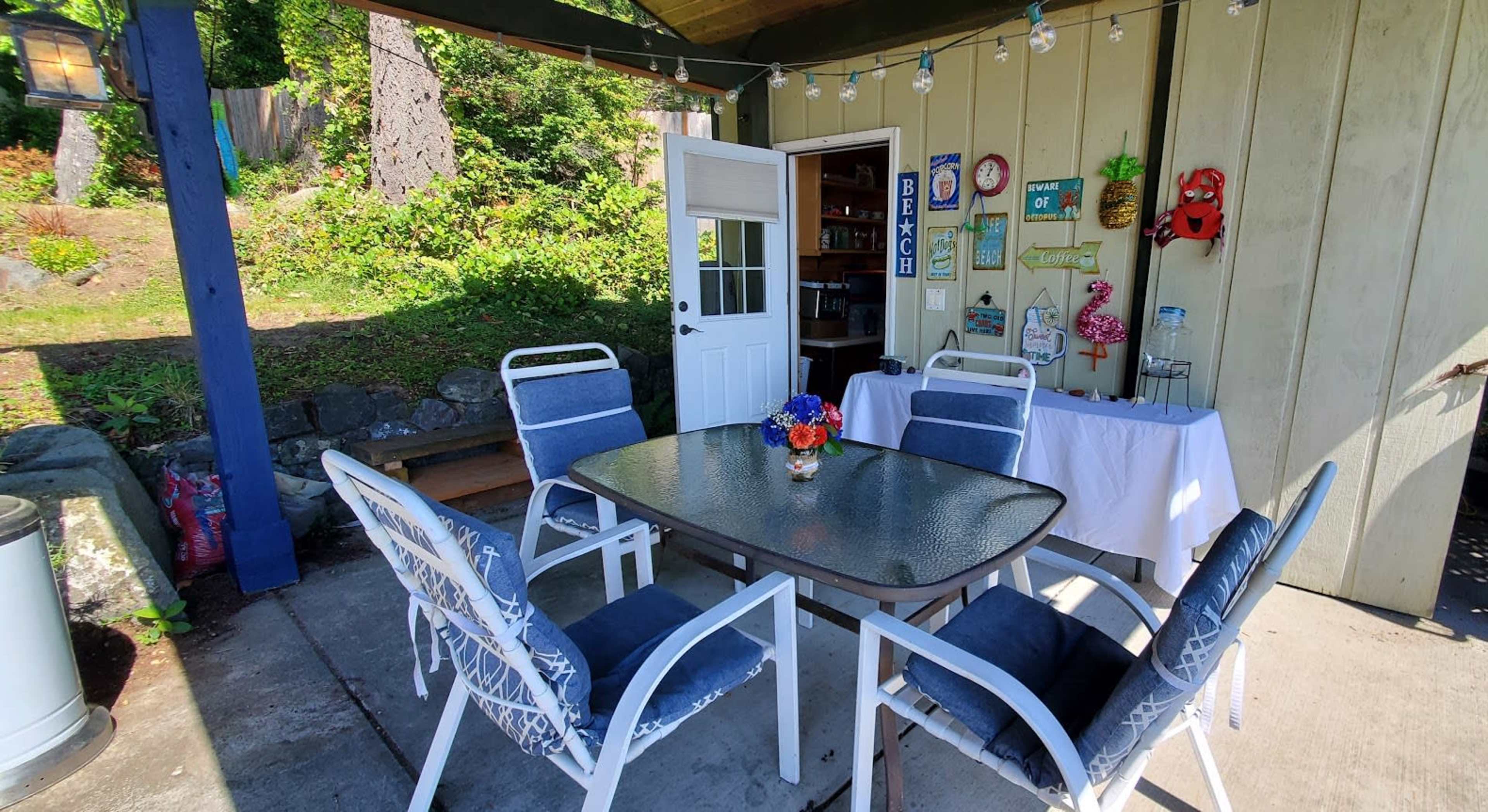 Cute Wide Waterfront Garden Patio Looking Towards Distant Mt. Rainier Image in Wauna, Gig Harbor, WA