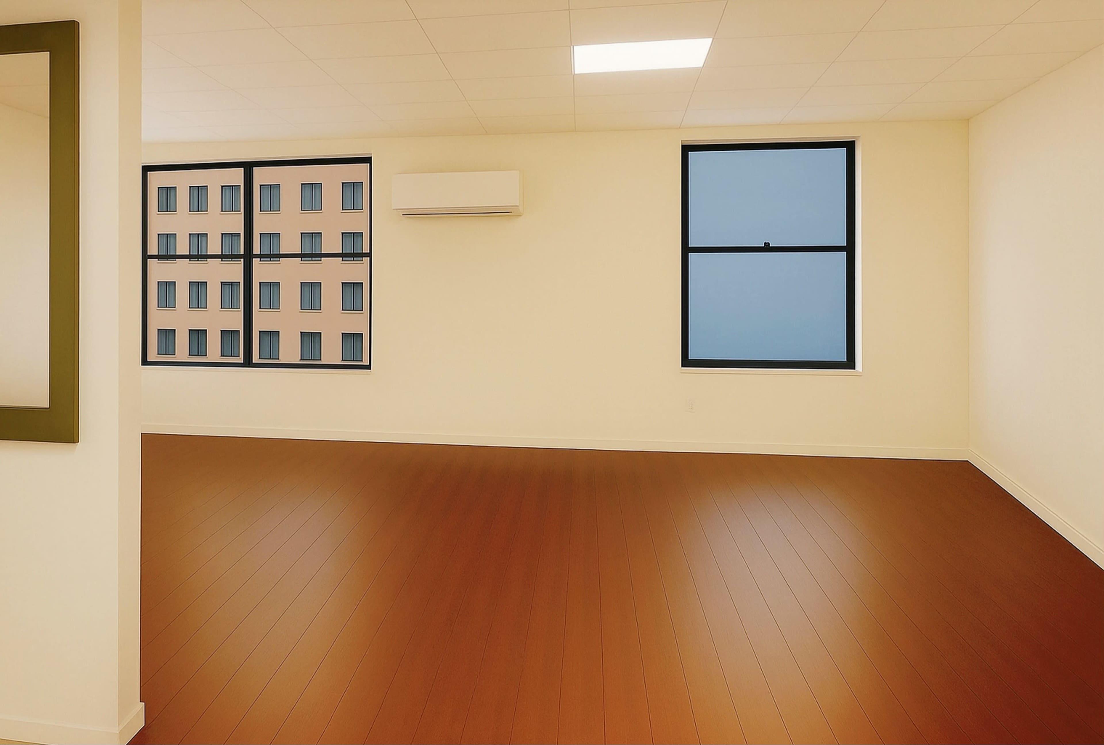 The image shows a spacious, empty room with hardwood flooring and two large windows overlooking a building with multiple windows.