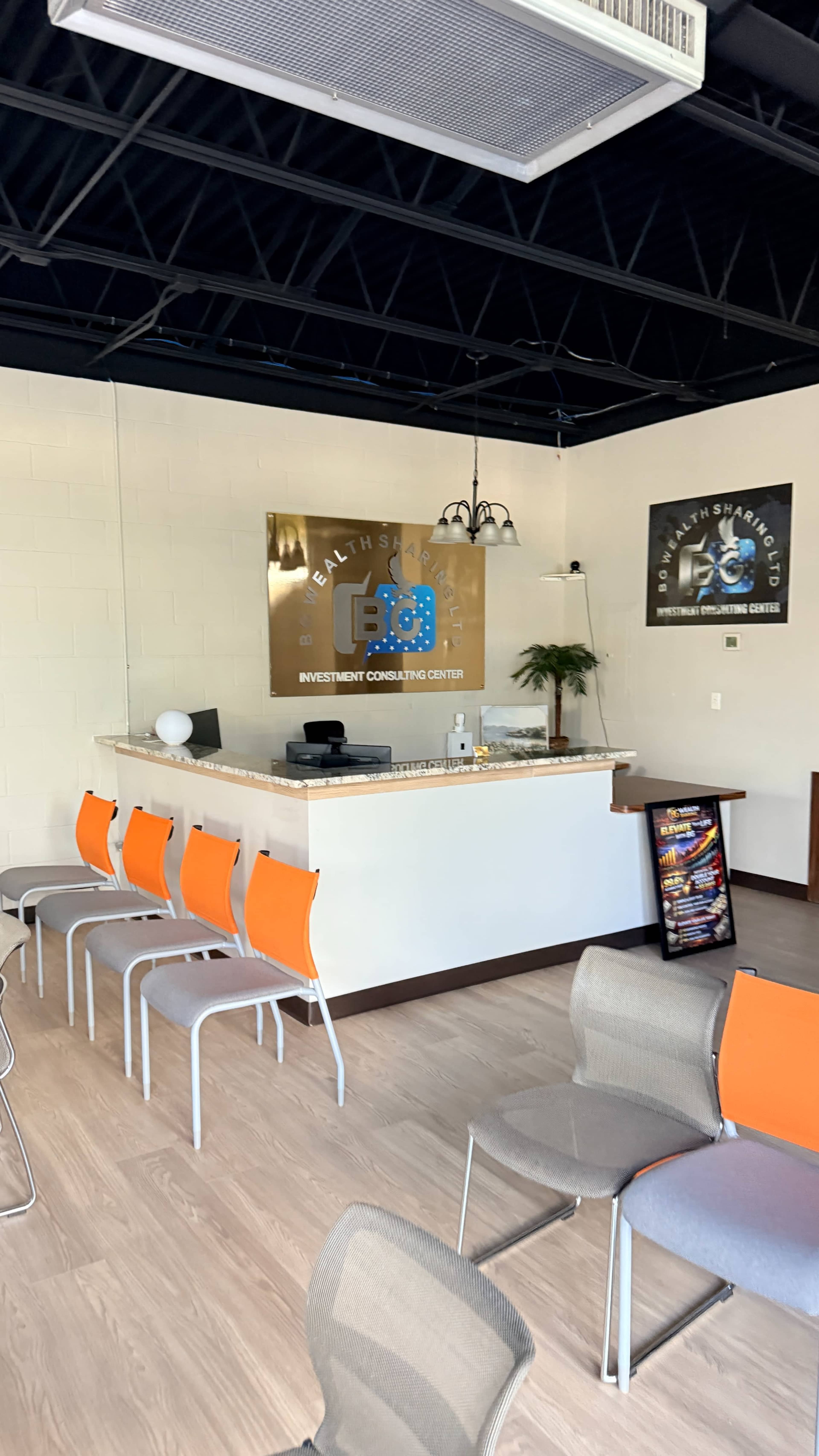 The image shows a modern reception area for an investment consulting center, with a front desk, chairs, and decorative elements against a light wall.