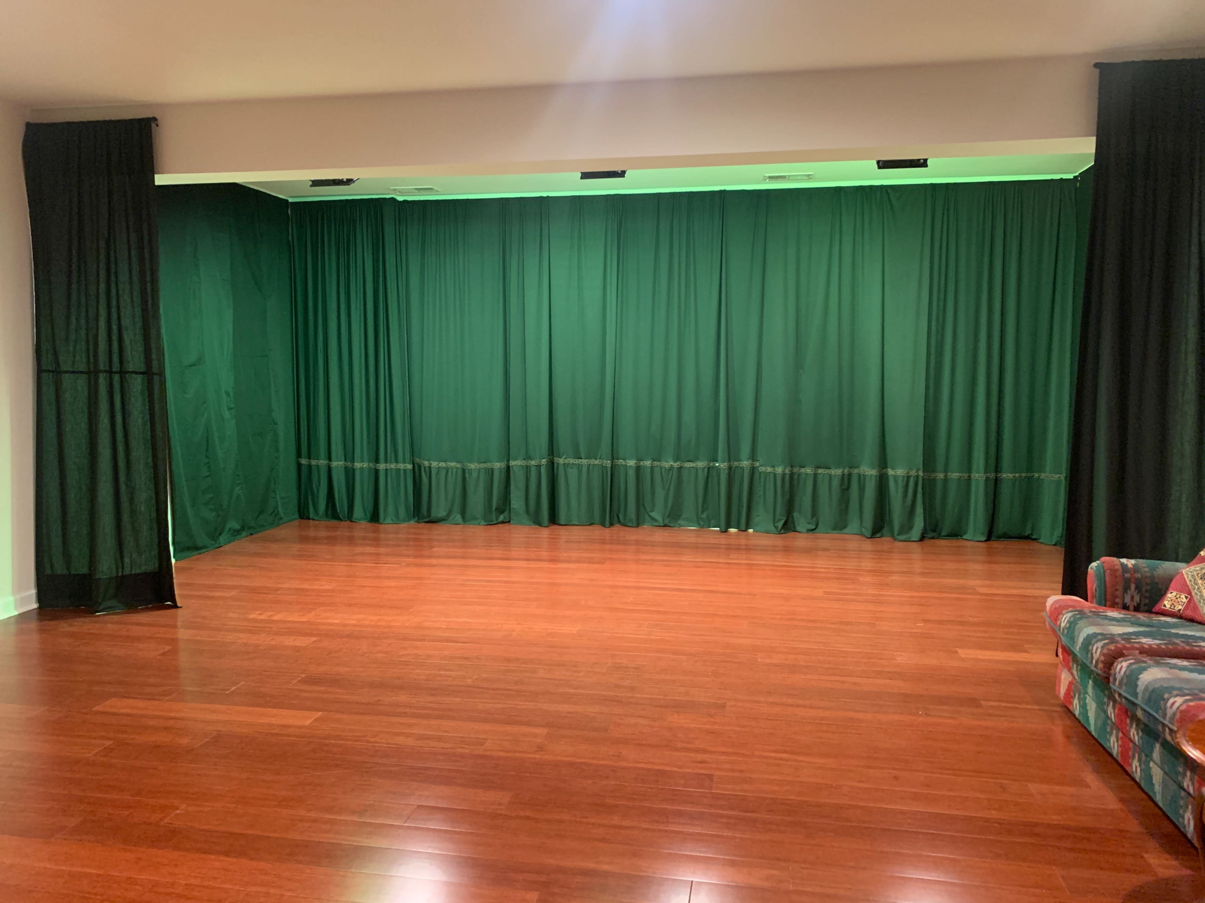 Entertainment room with continuous floor space and backdrop curtain Image in Maple Lawn, Fulton, MD