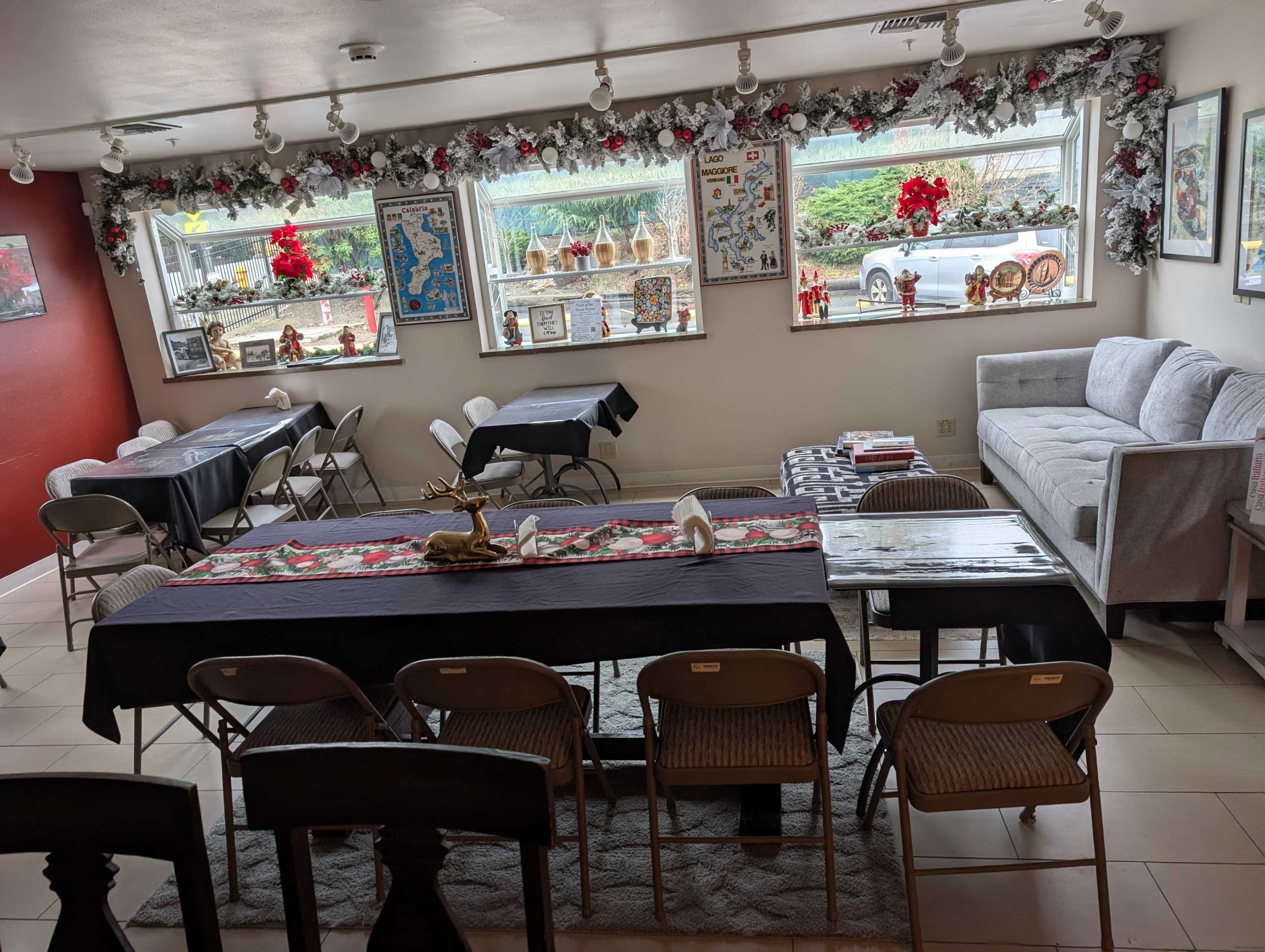 Cozy Caffe meeting room with couch and large screen tv Image in Evansville, Burien, WA