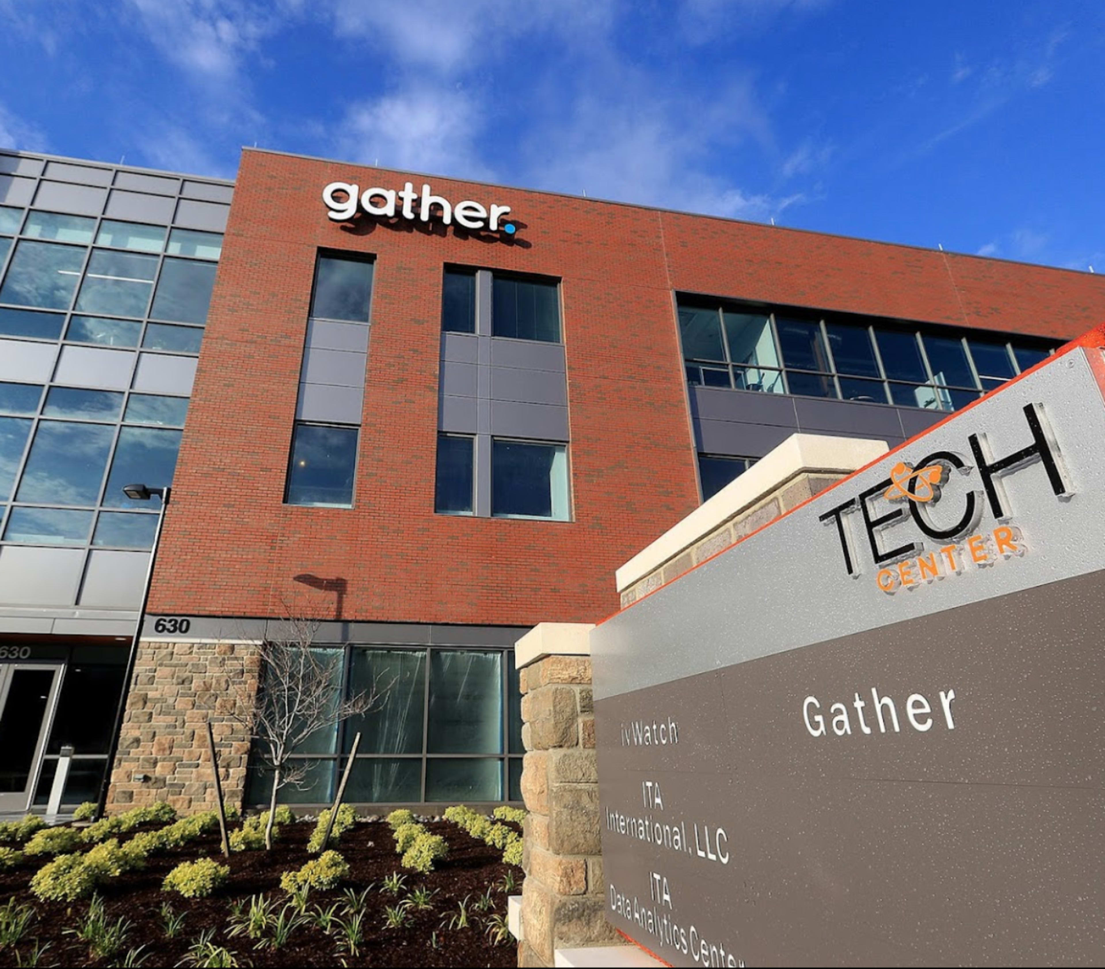 A modern brick building with the signage "Gather" prominently displayed, along with a sign for the "Tech Center" and other business names.