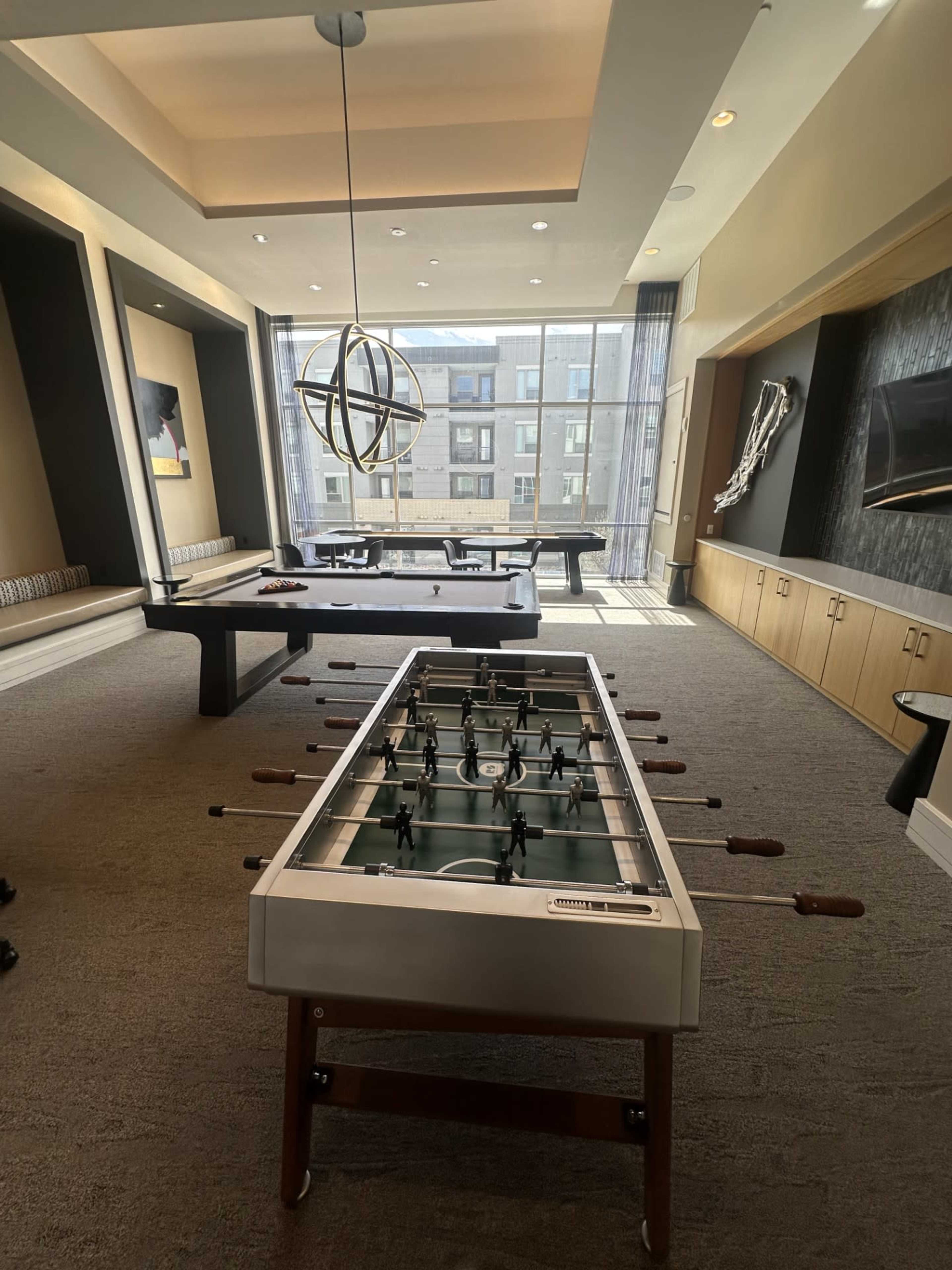 Open Game Room with Shuffleboard, Foosball Table, and Pool Table perfect for your next event Image in Lowry, Denver, CO