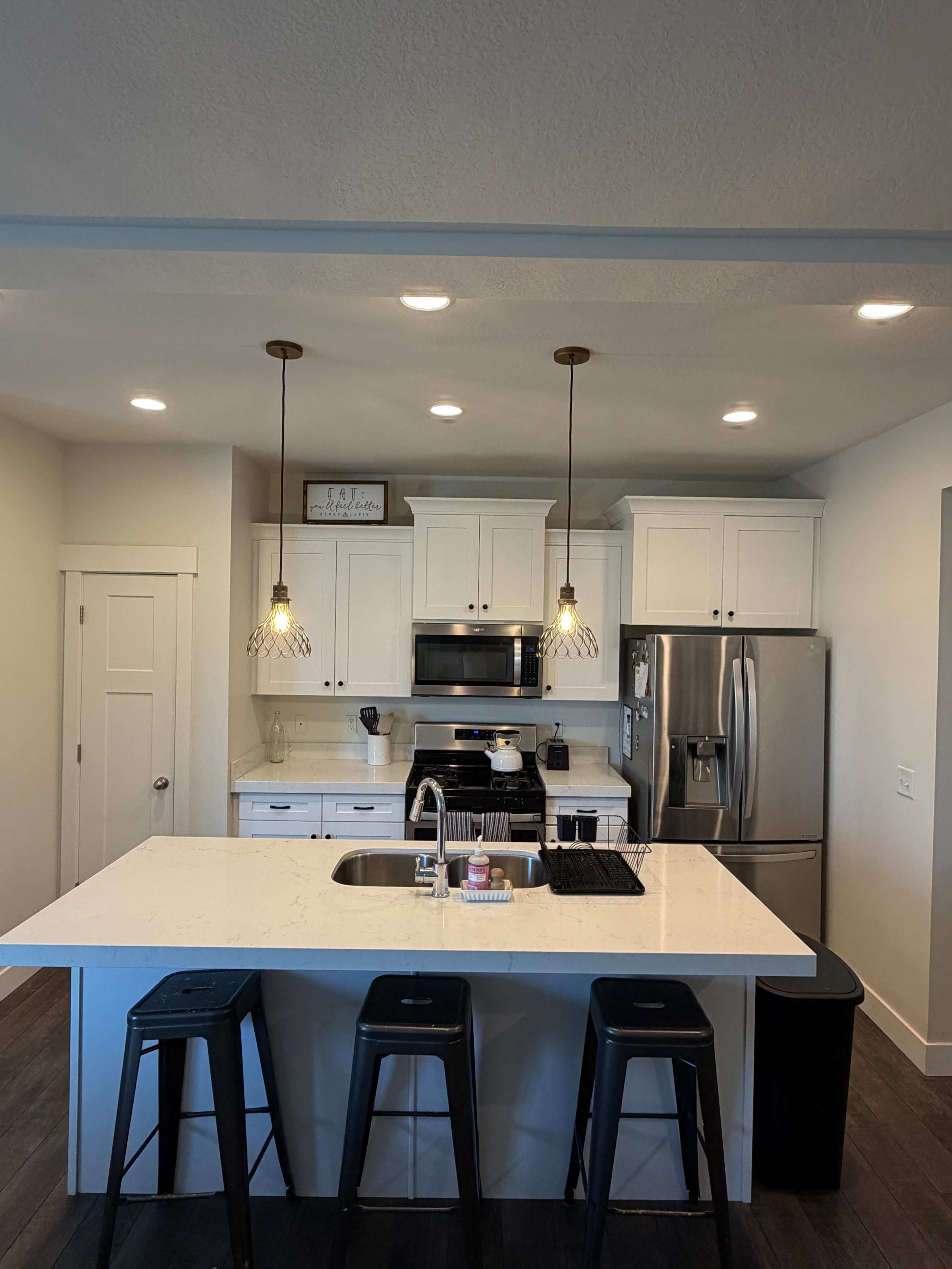 Modern Versatile Townhome with Brick Wall, Living Areas, and Content Creation Space Image in Sandy, Sandy, UT