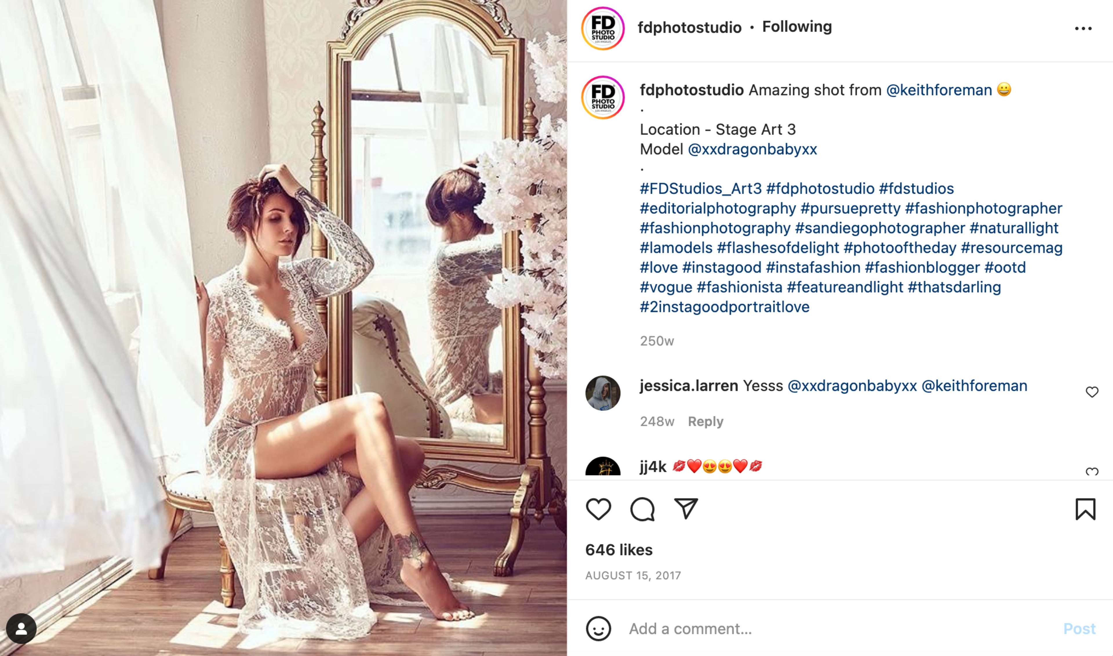 A model in a shimmering, sheer dress poses in front of a large window with natural light illuminating the scene.