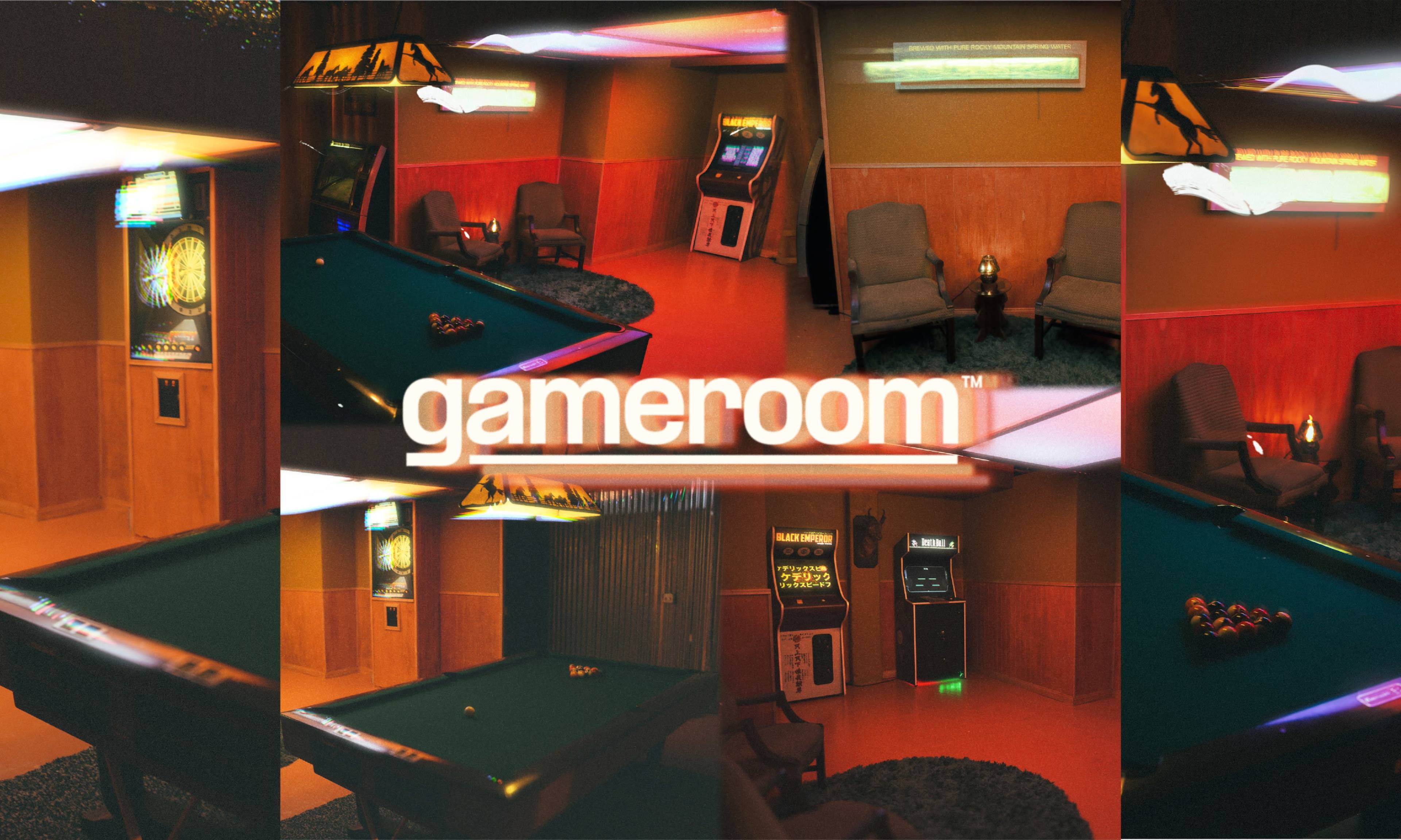 The image features a cozy game room with a pool table, arcade machine, and lounge seating, illuminated in warm tones.