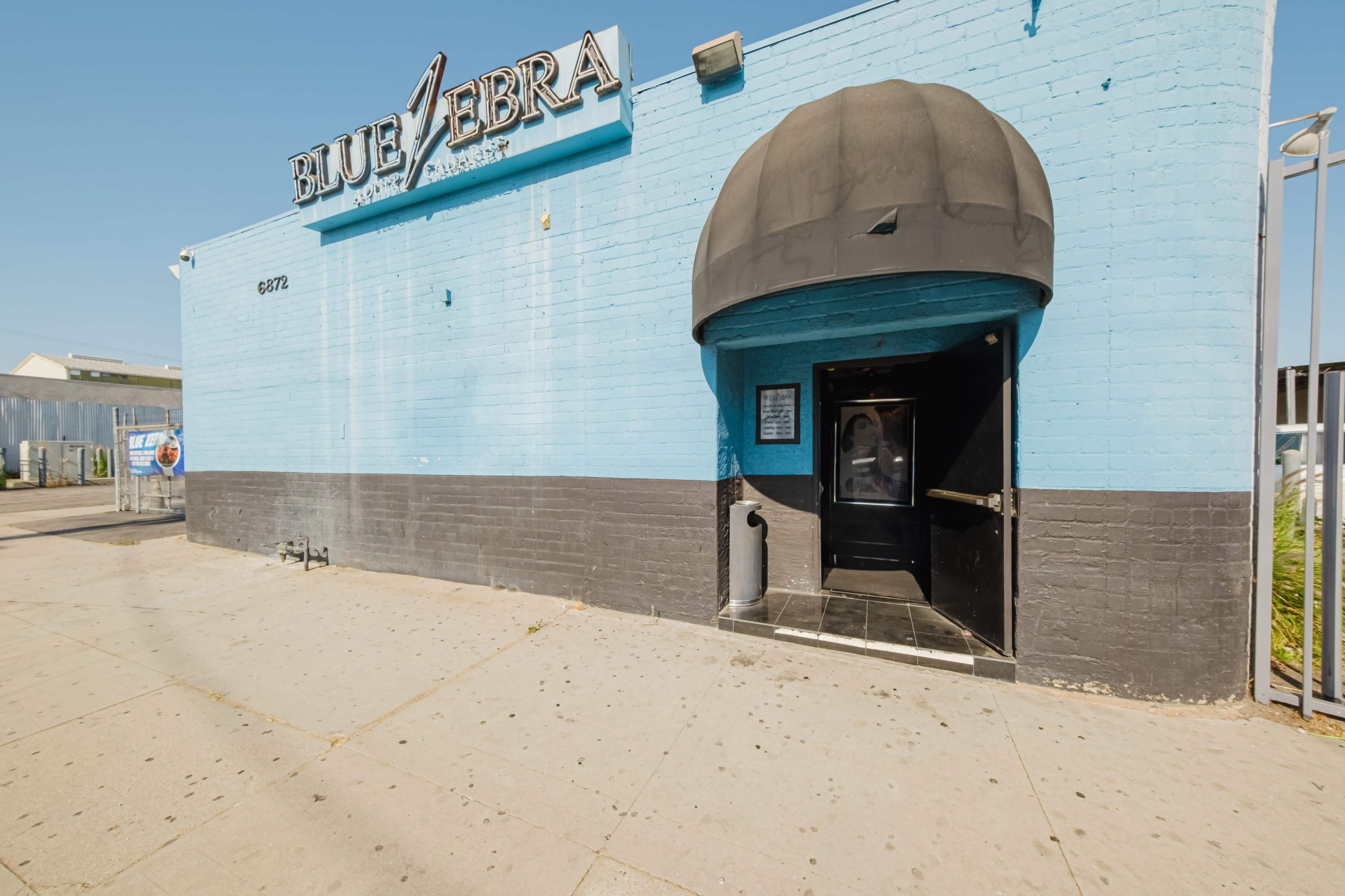 BLUE LIGHTS, ZEBRA NIGHTS: ICONIC GENTLEMAN’S Image in North Hollywood, Los Angeles, CA