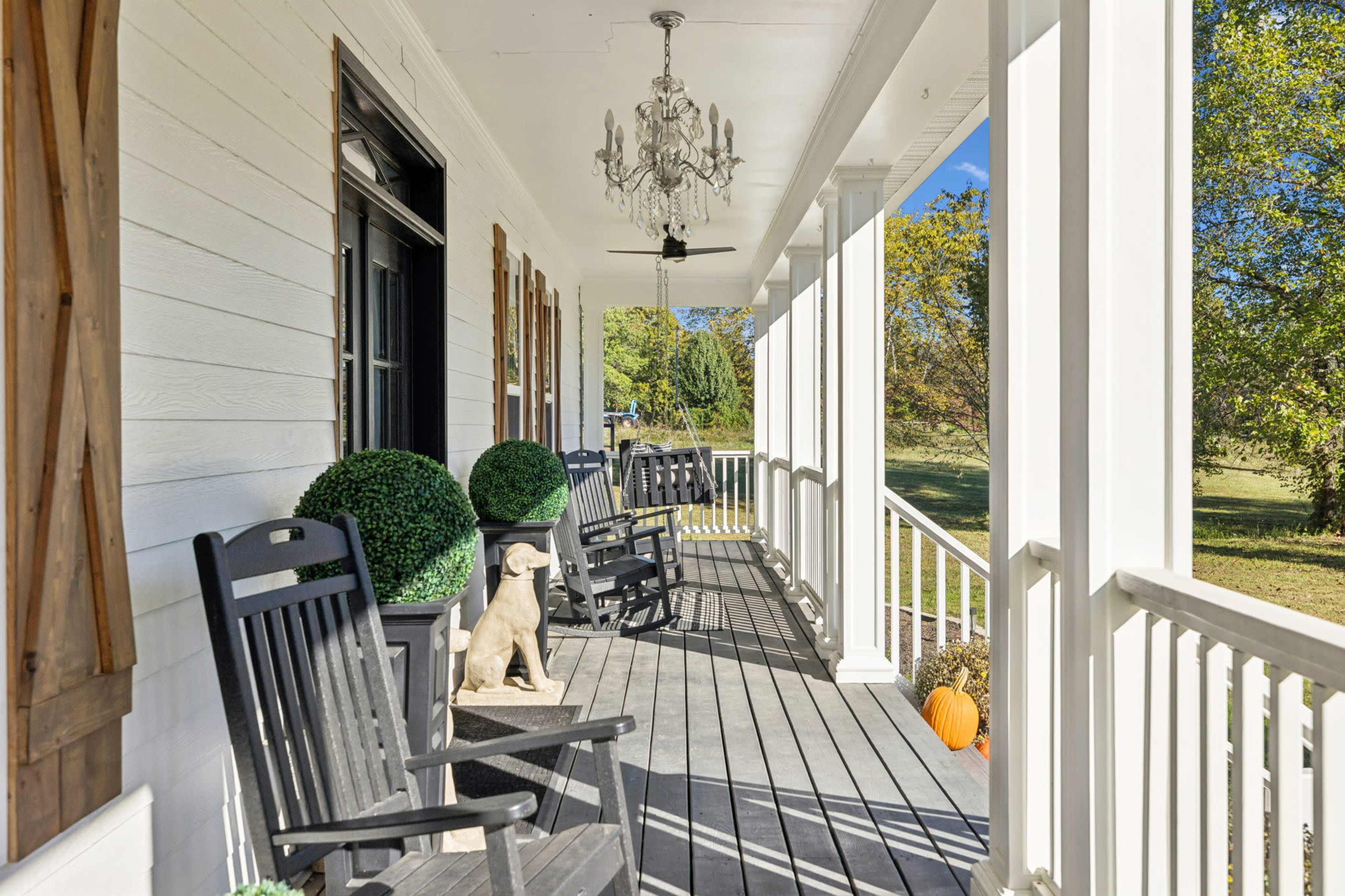 New Listing! A True Southern Porch — Wrap-Around Views, Rockers & Warm, Natural Light Image in , Fairview, TN