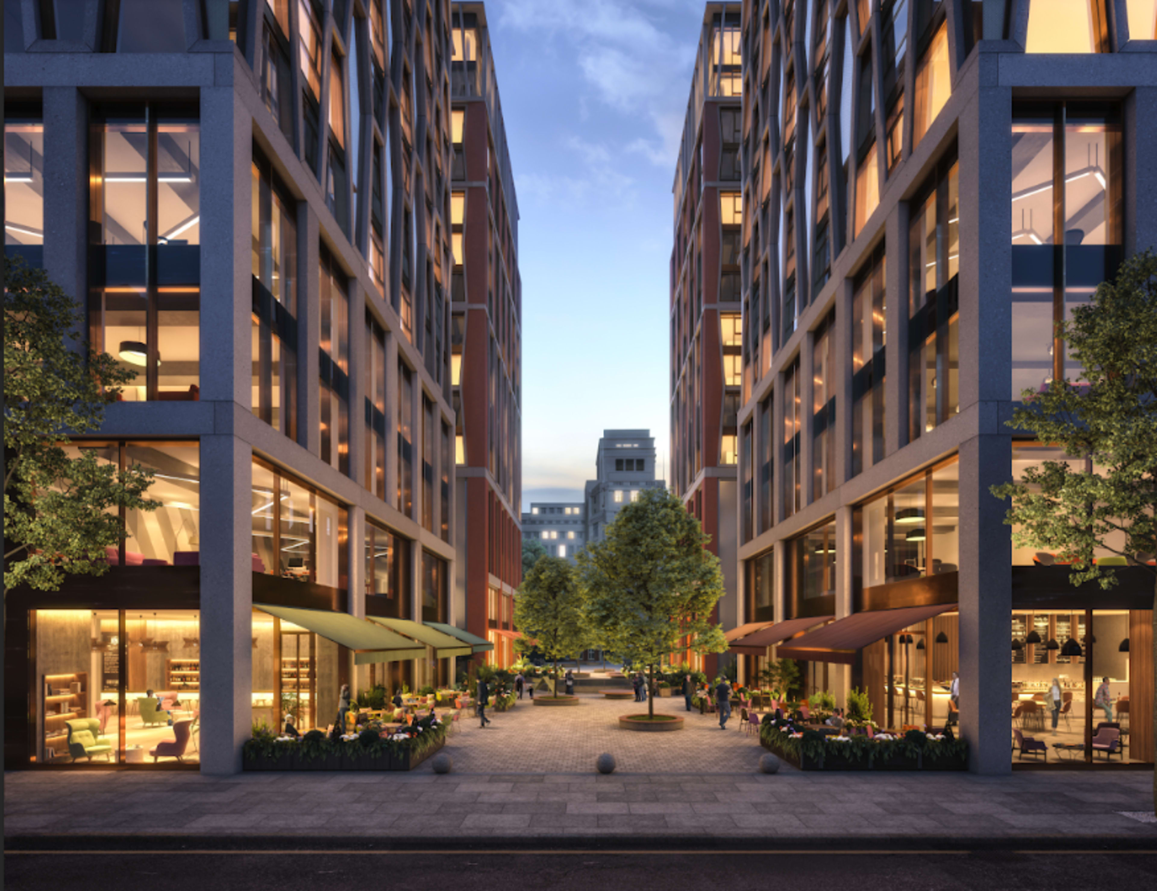 A modern urban plaza is flanked by multi-story buildings with large windows and outdoor seating areas under awnings.
