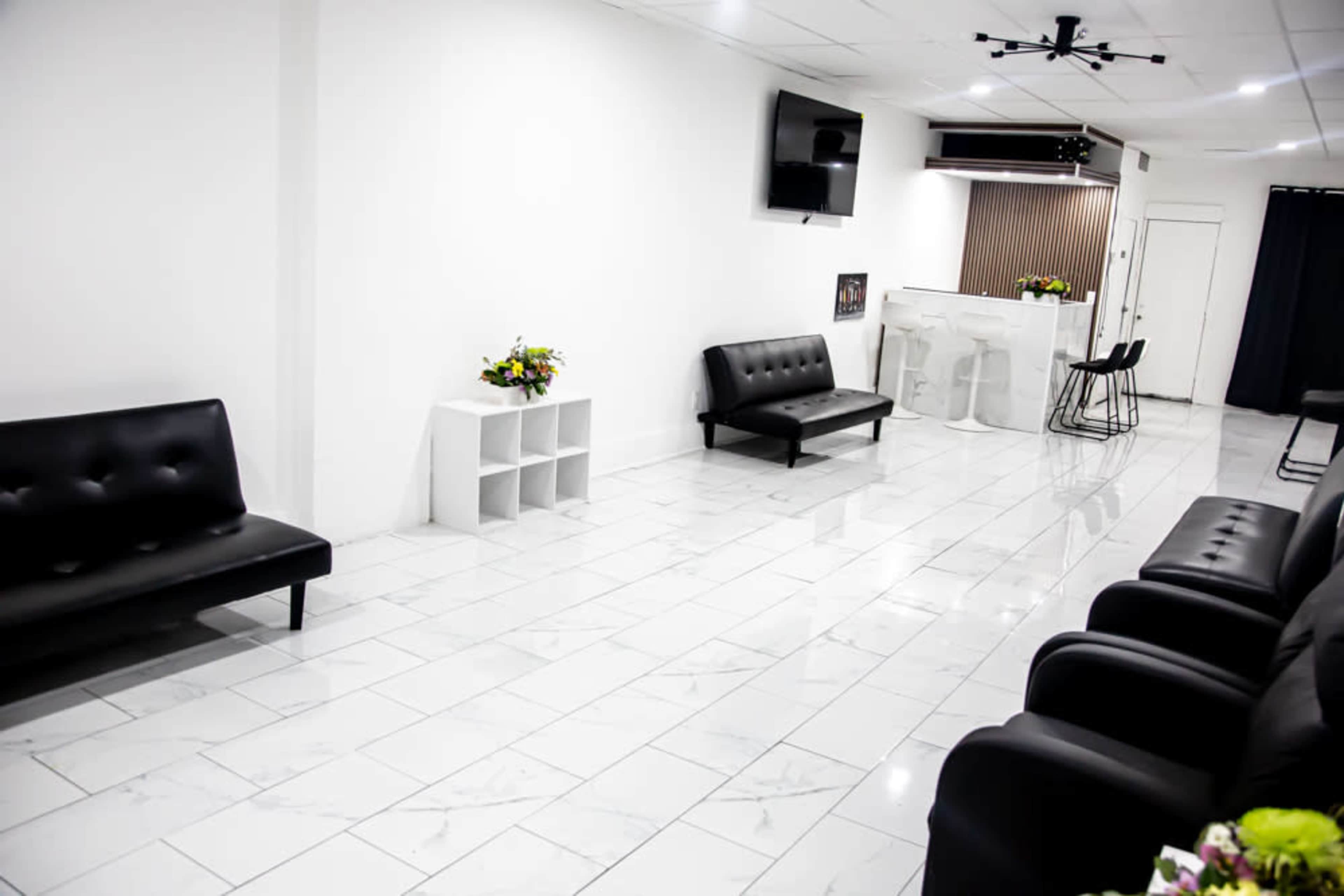 Elegant Black & White Space with Marble Floors and a Wood-Finished Bar Image in Hempstead, Baldwin, NY
