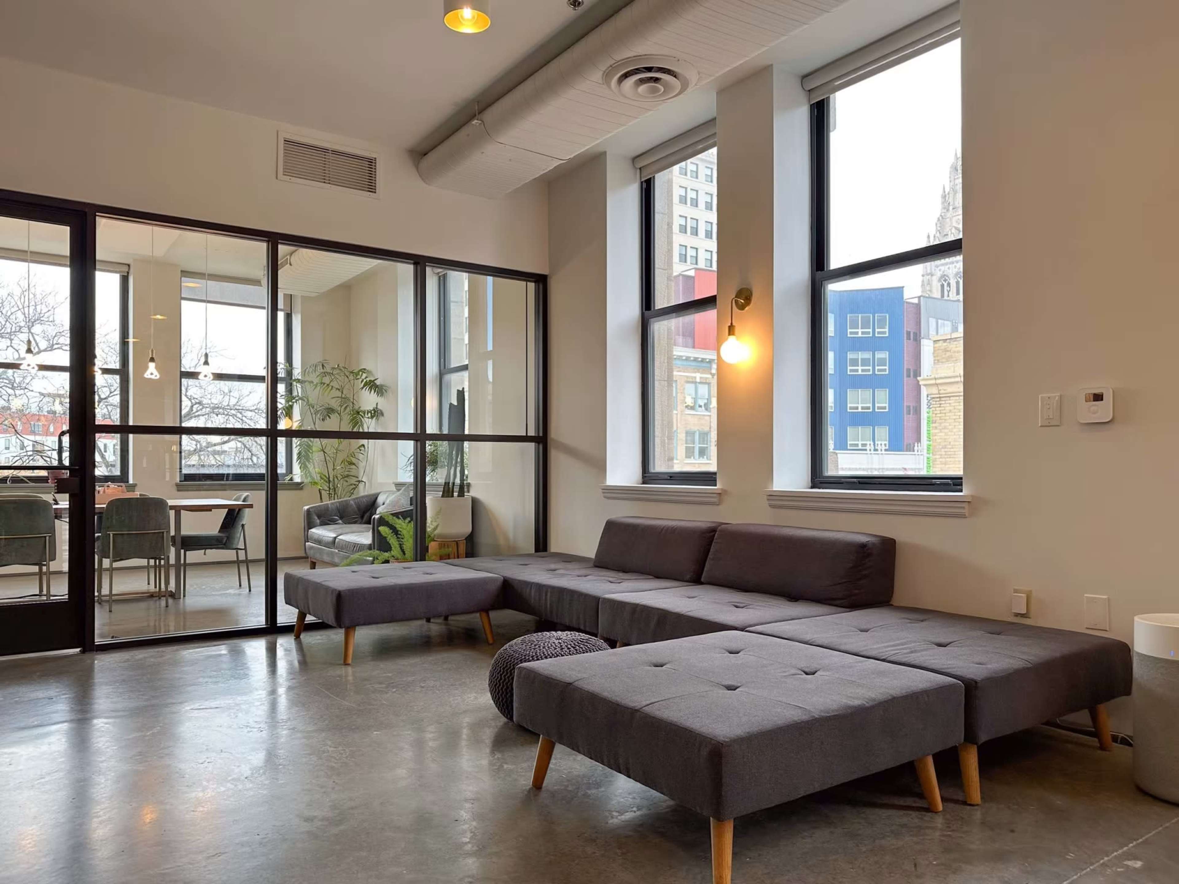 Bright, Beautiful Meeting Room with Huge Windows, Glassboard, and TV for Screen Mirroring Image in East Liberty, Pittsburgh, PA