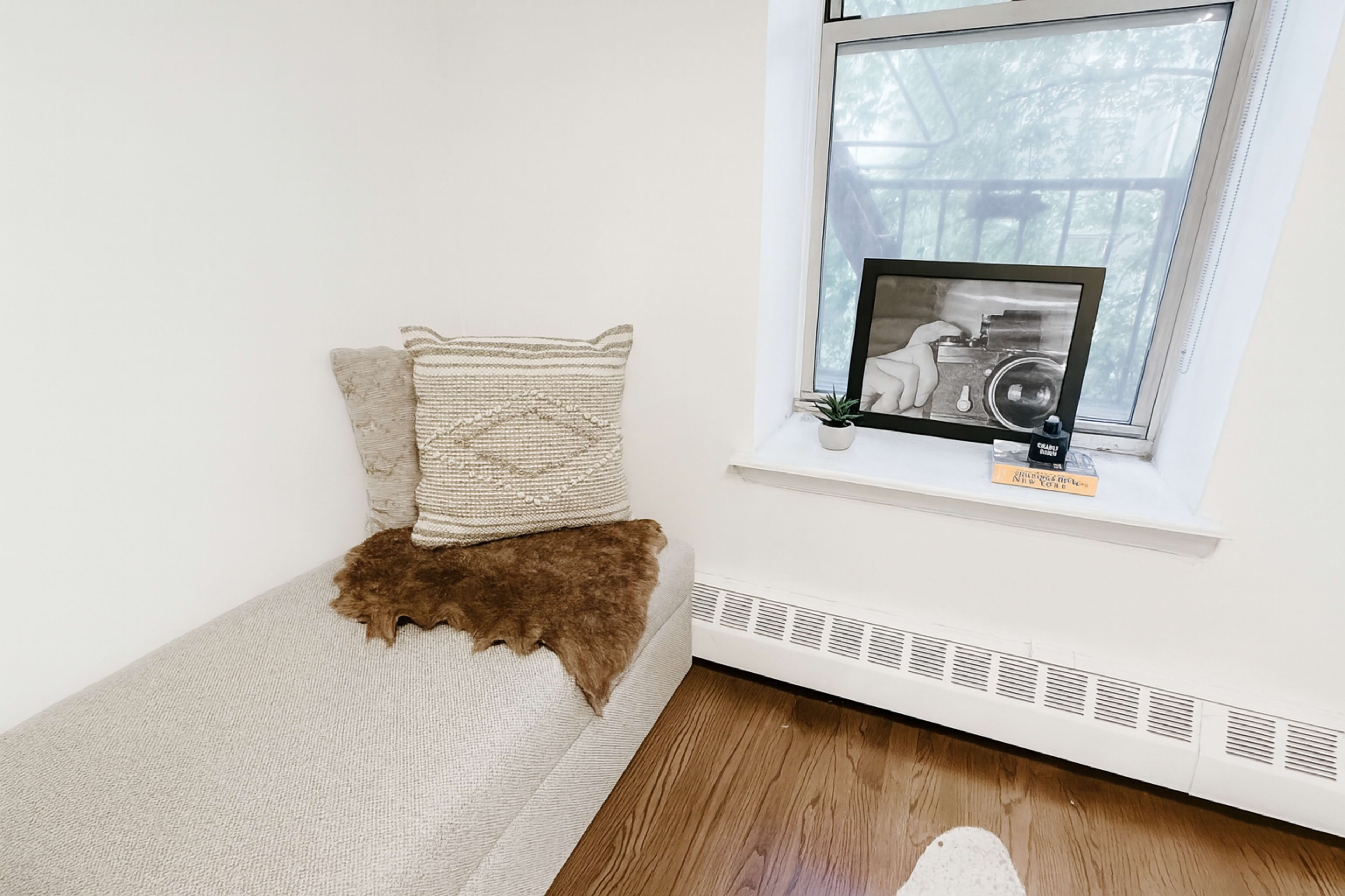 Modern Harlem Hideaway Apartment with Warm Lighting and Artistic Touches Image in West Harlem, New York, NY