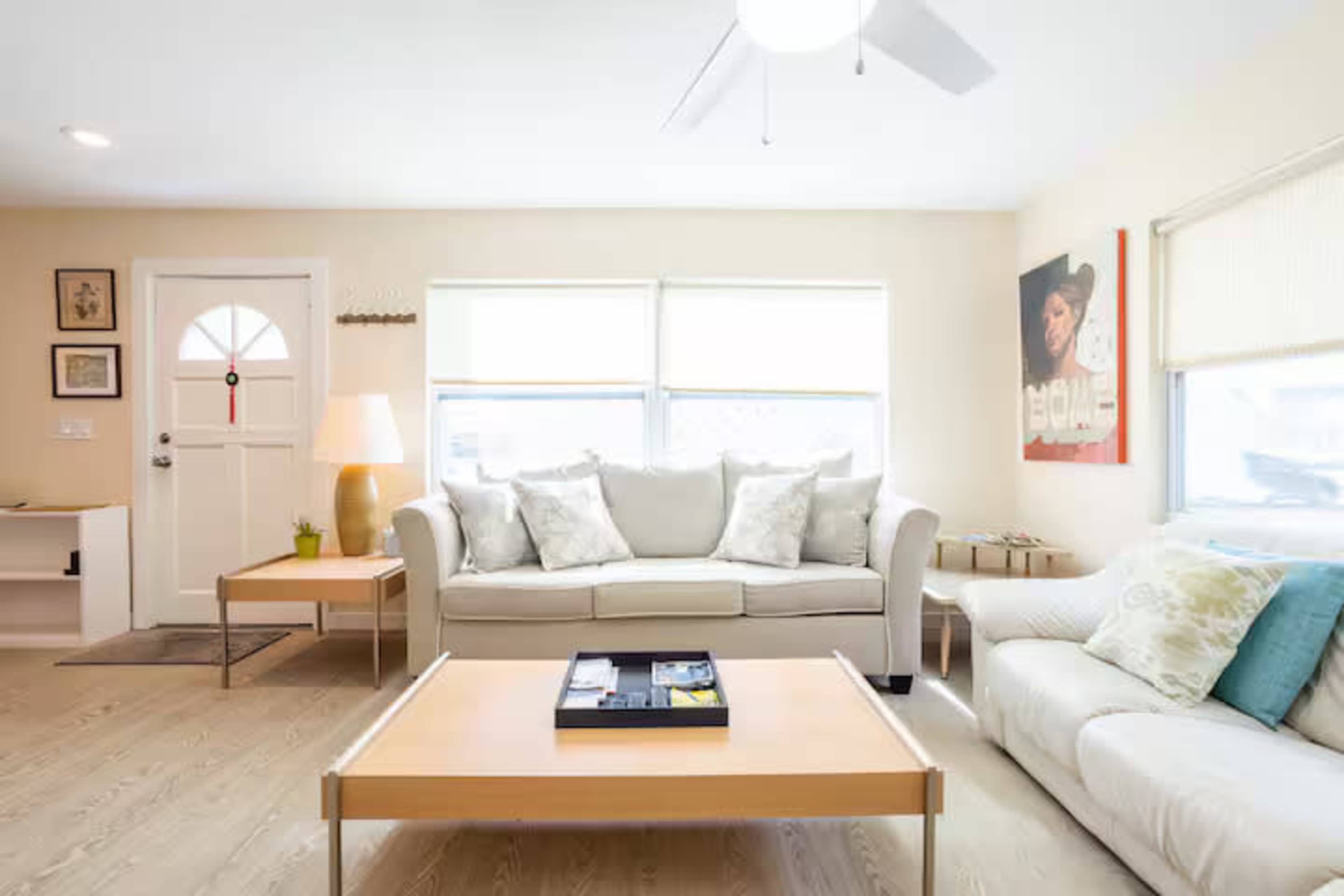 Cheerful downtown home flanked by empty green spaces Image in Gillespie Park, Sarasota, FL