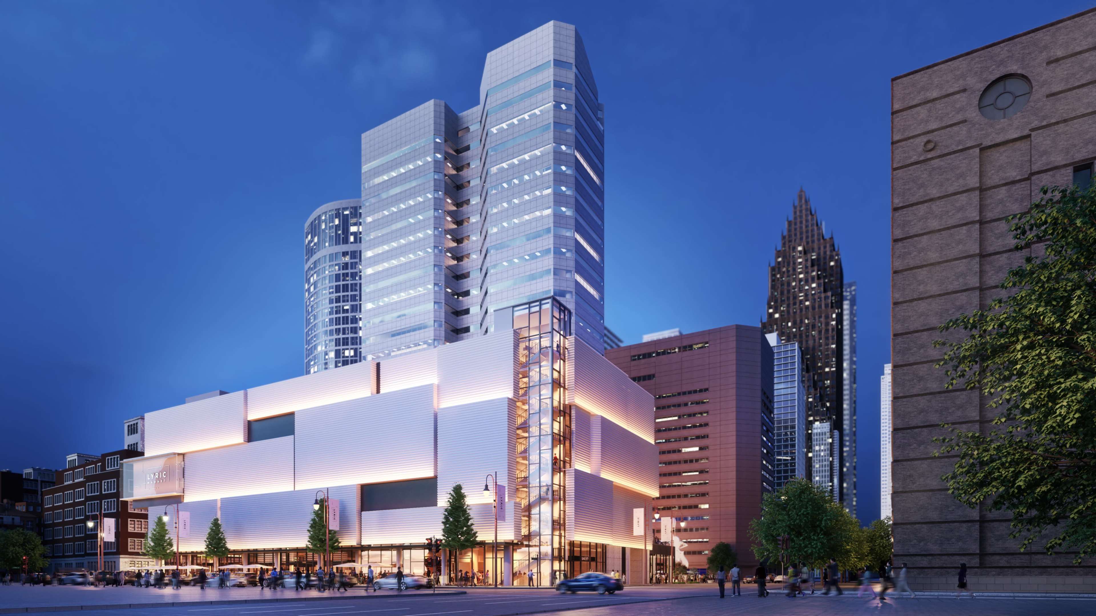 A modern multi-story building with sleek architecture illuminated at dusk, surrounded by urban skyscrapers and city streets.