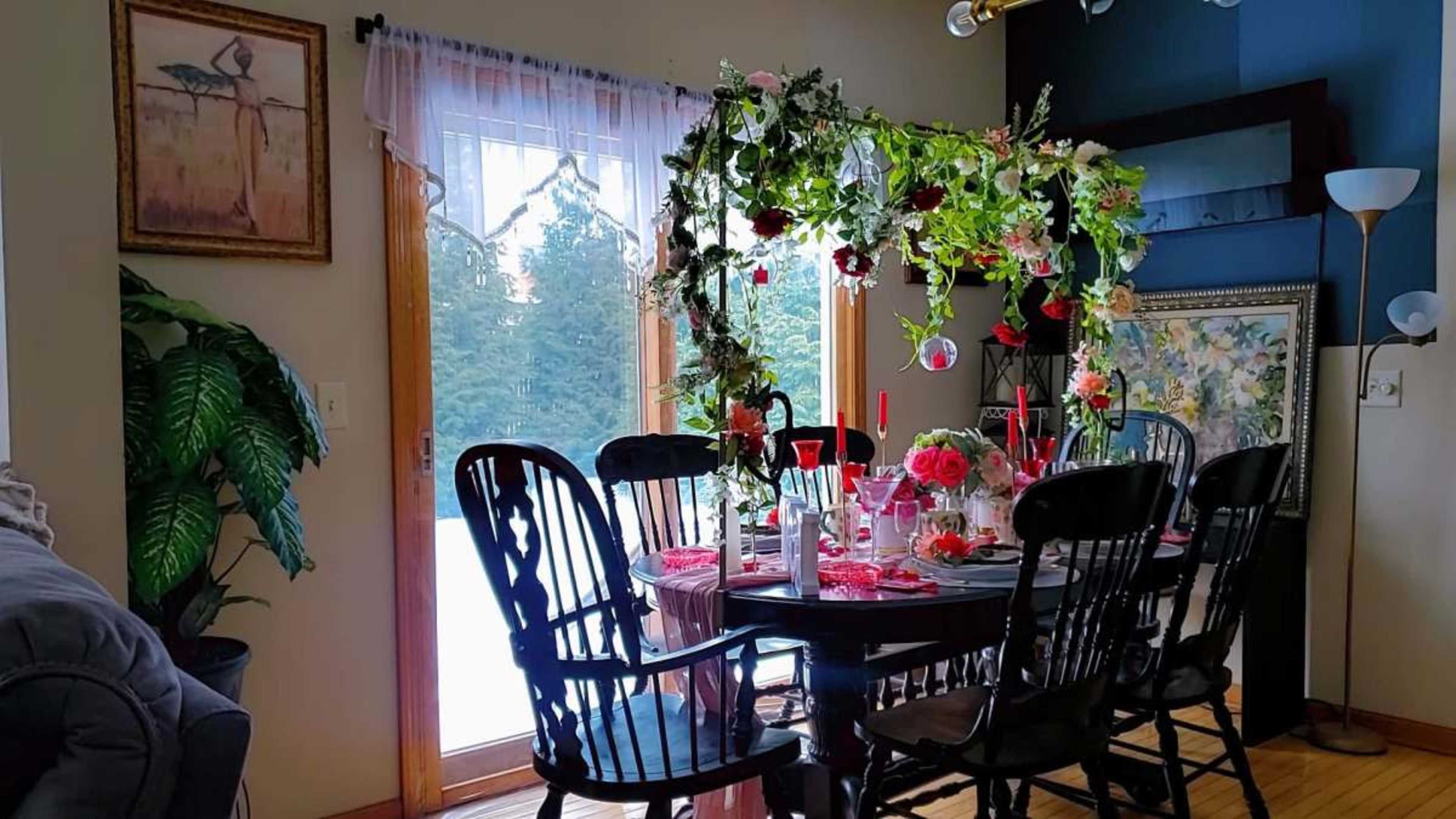 Love Fest/ Themed dinners/ private meetings.A romantic and intimate dinner party setting, perfect for Valentine's Day or a special occasion, featuring a beautifully decorated table with heart-shaped plates, candles, and flowers. Image in LaSalle, Buffalo, NY